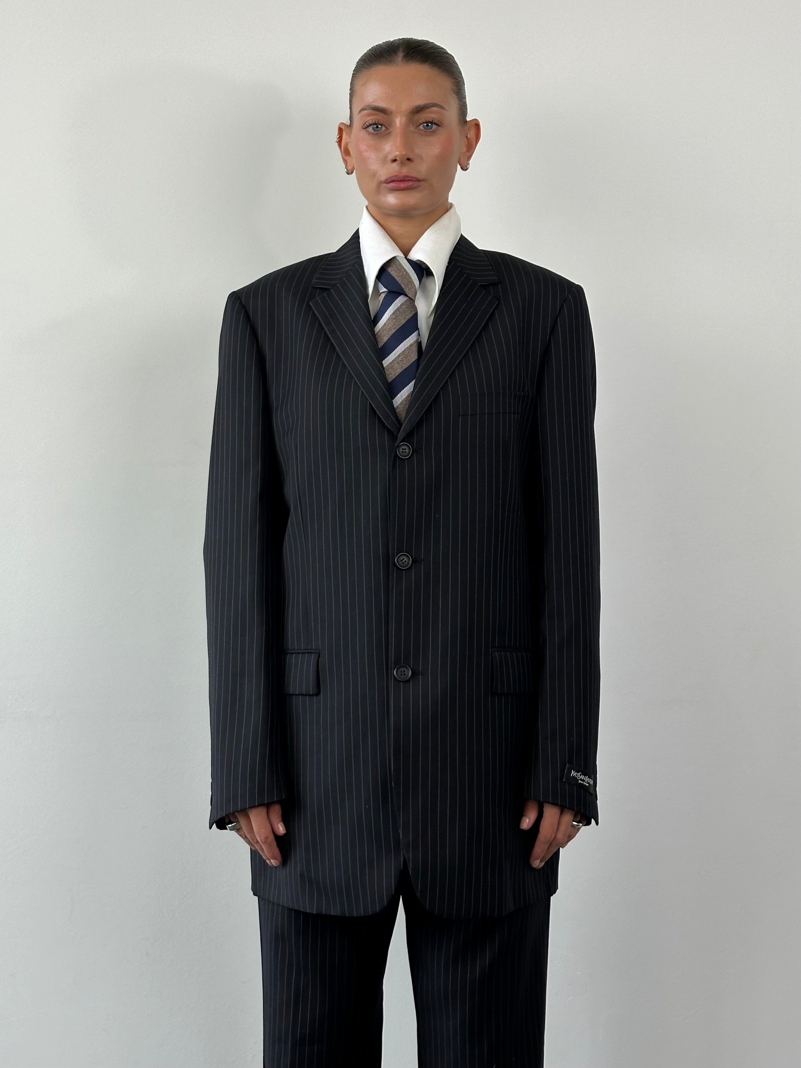 Yves Saint Laurent Pour Homme 1990s wool pinstripe single-breasted suit, size 40L/W32, shown on a mannequin with a classic fit.