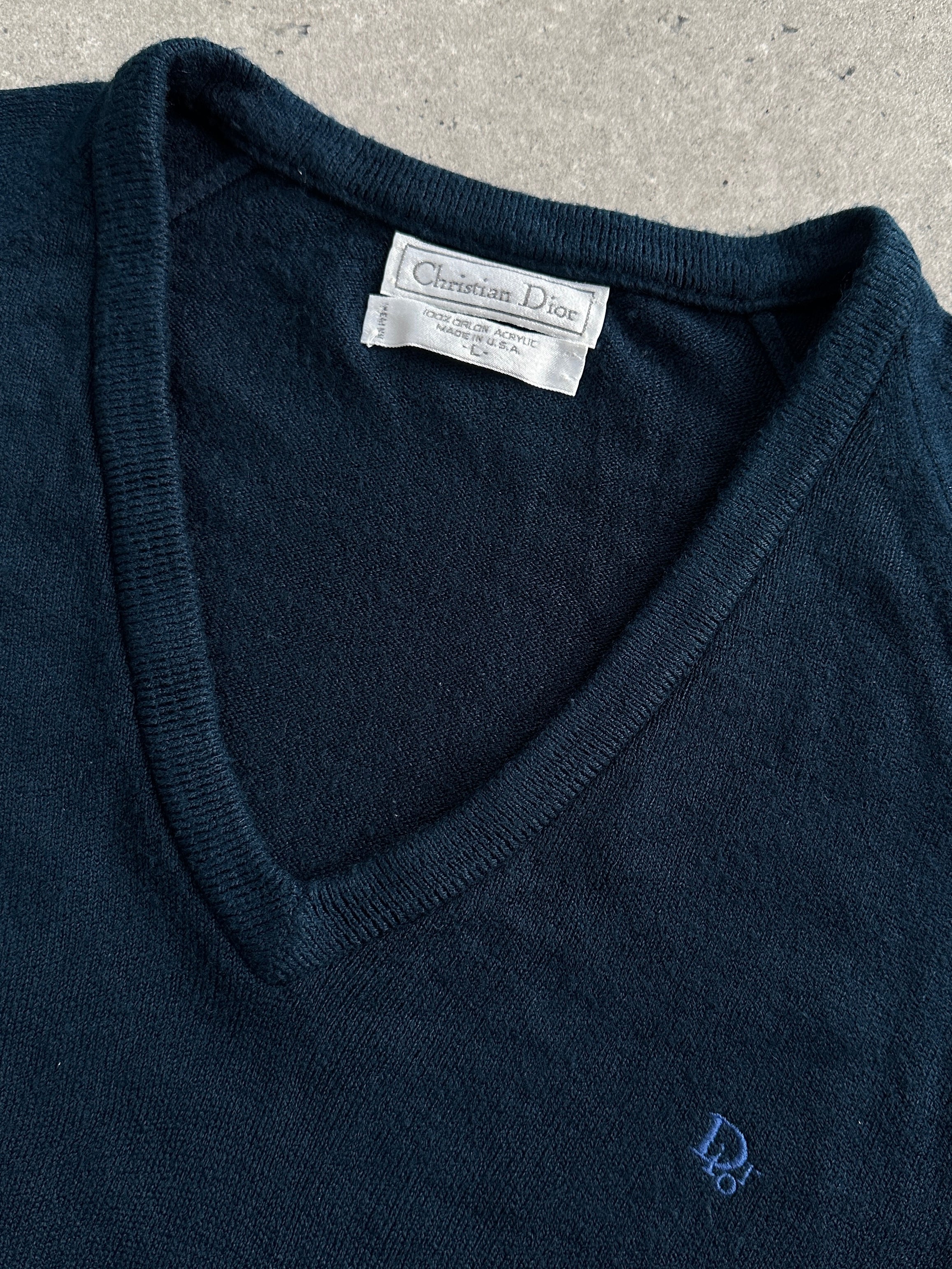 Christian Dior 1980s V-neck logo knitted jumper in size L, featuring classic Dior branding and a cozy knit fabric.