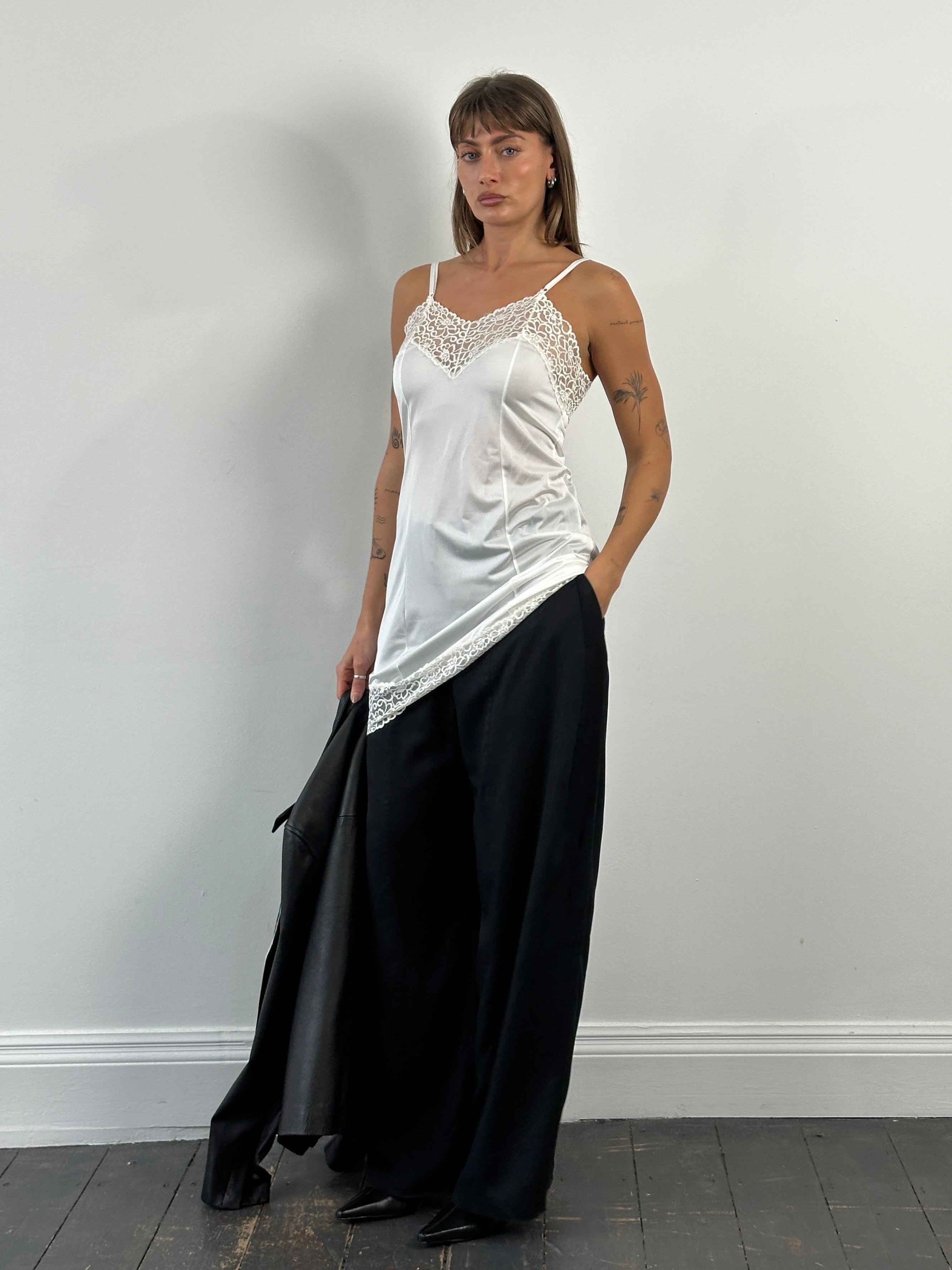 Vintage Japanese 1990s lace sheer mini slip dress in size small, featuring delicate lace fabric and vintage-inspired design.