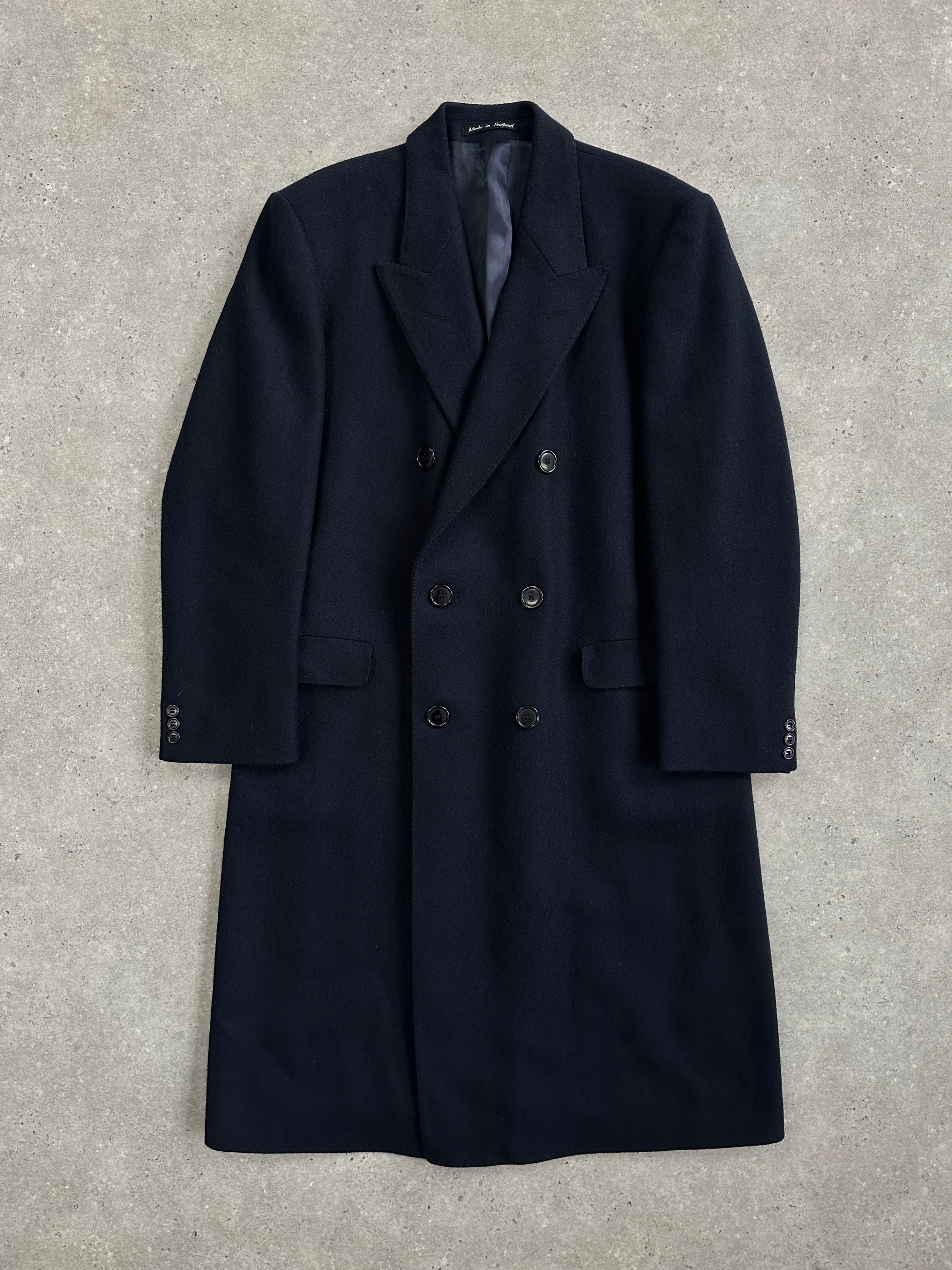 Vintage British 1990s double-breasted wool coat, XL size, classic 90s style, with wide lapels and button details.