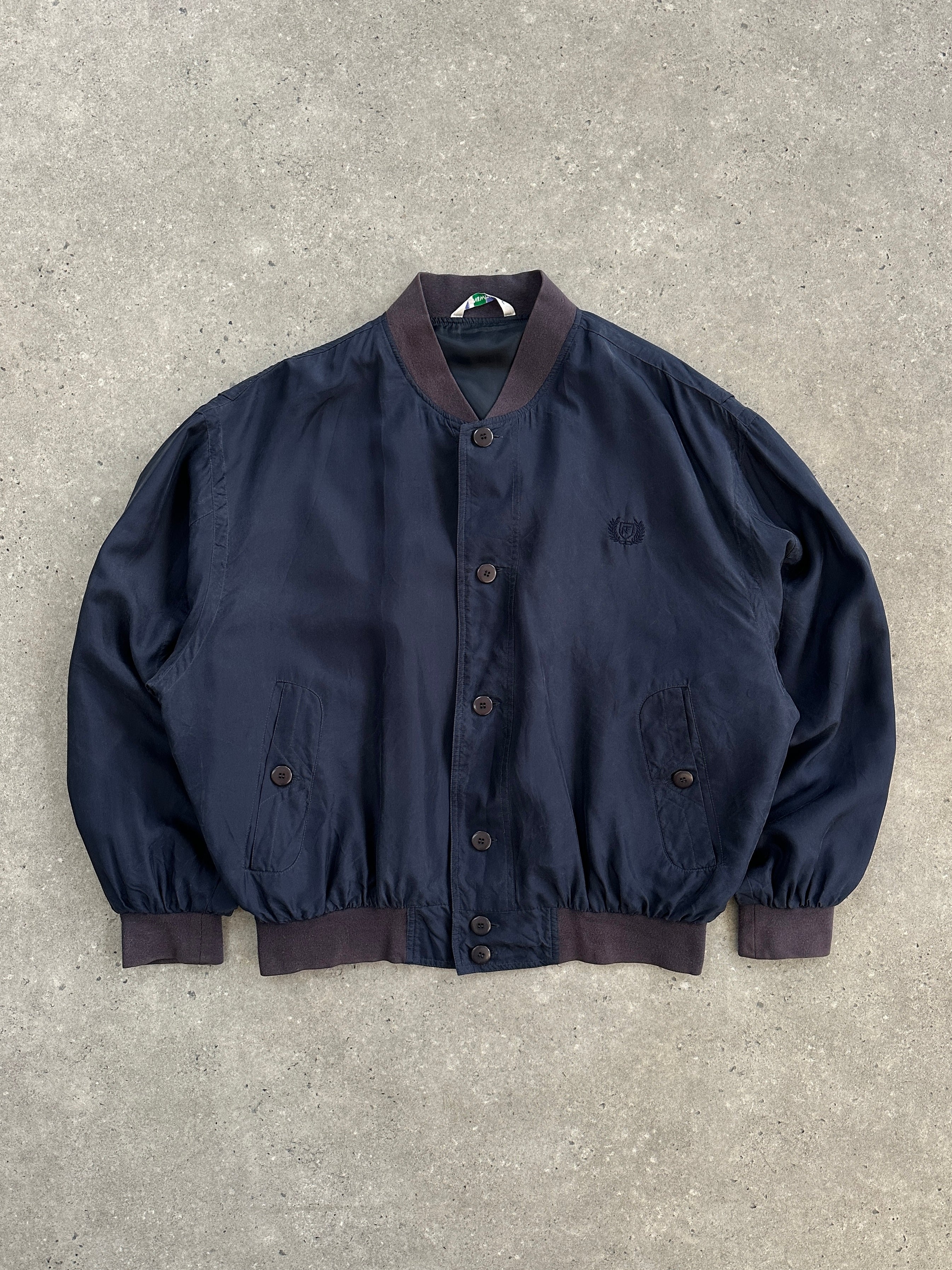 Vintage 1990s pure silk bomber jacket in size large, featuring a classic retro style and smooth silk fabric.