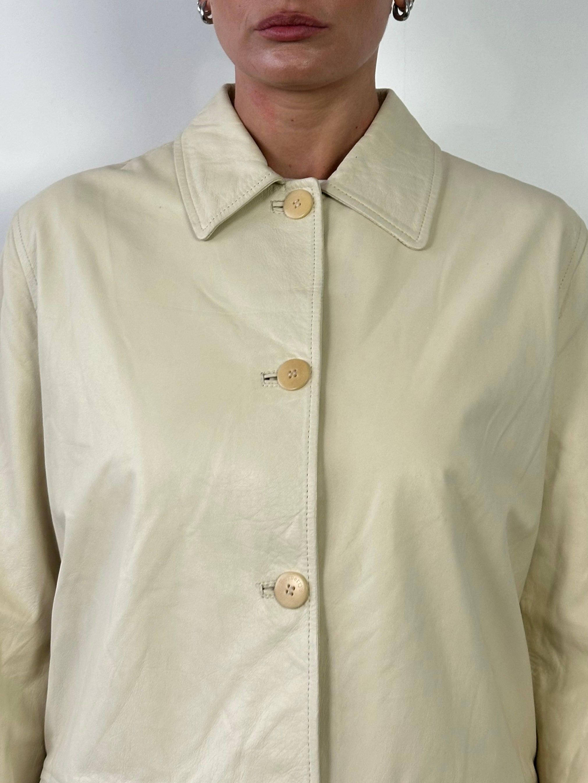 Burberry boxy leather jacket in black with classic collar and zip front, displayed on a hanger.