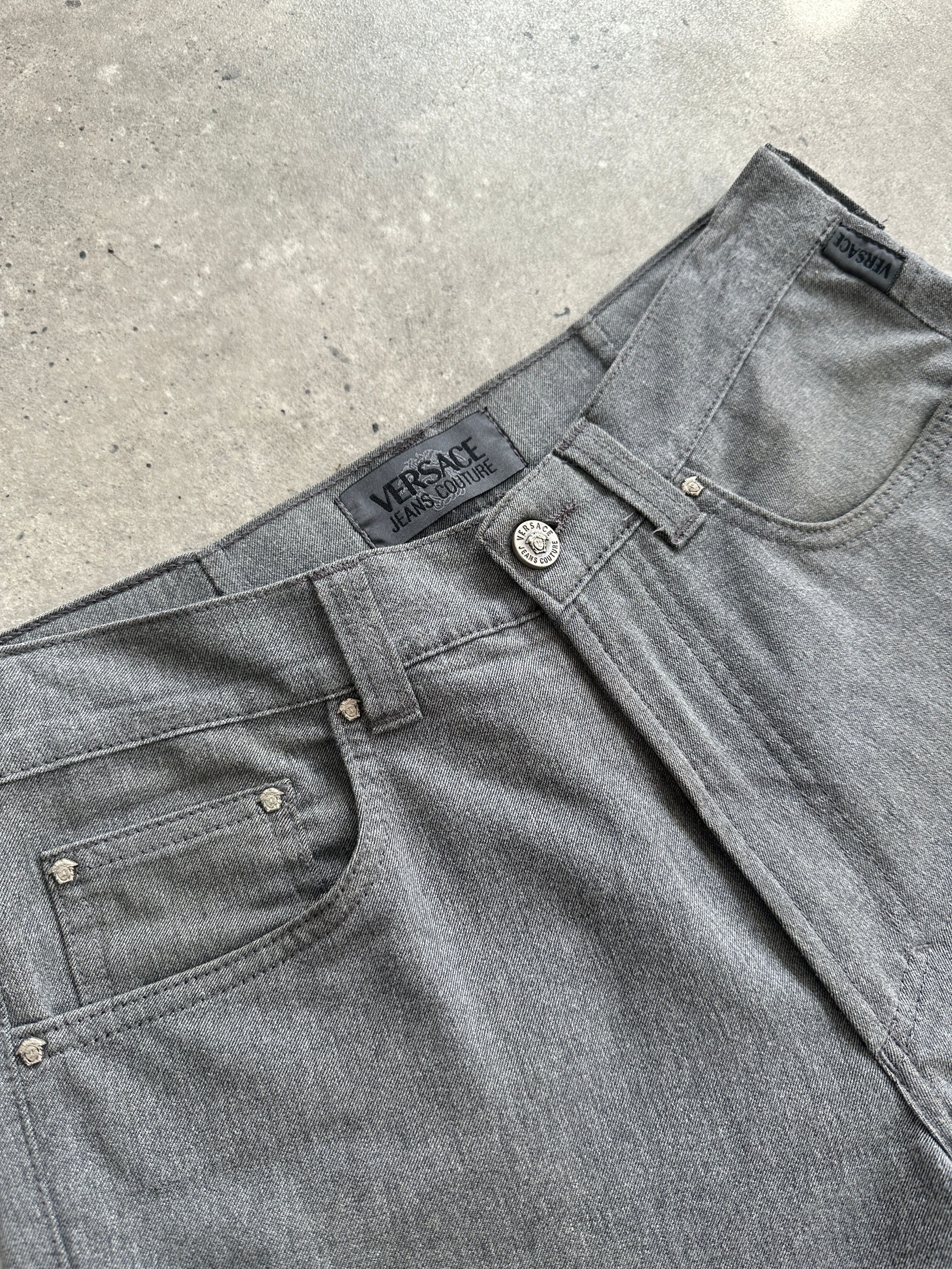 Versace Jeans Couture high waisted straight leg jeans in size W28, denim fabric with classic five-pocket design.