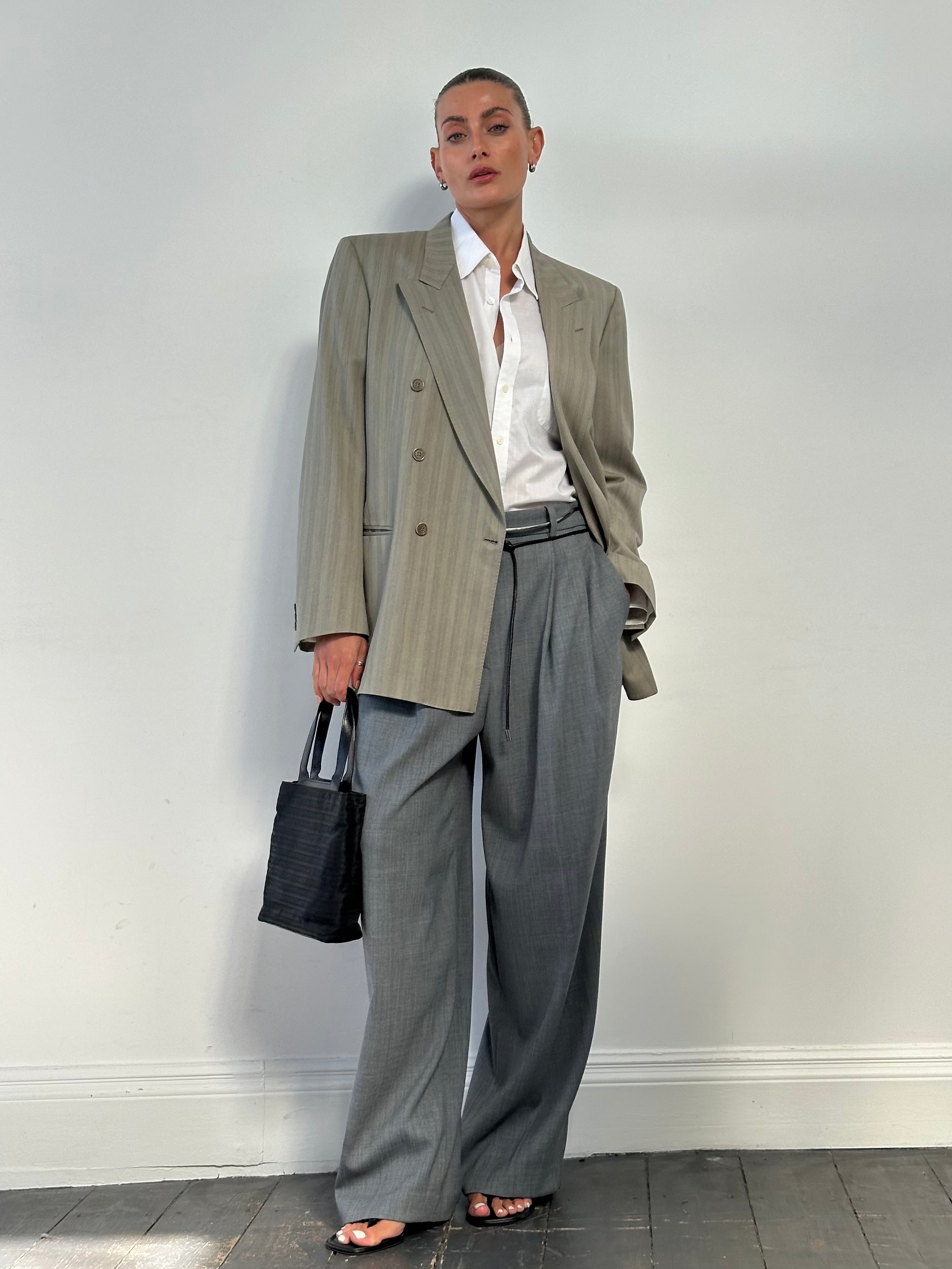 Vintage Italian pure wool double-breasted blazer in size L, featuring classic design and tailored fit, shown in the image.