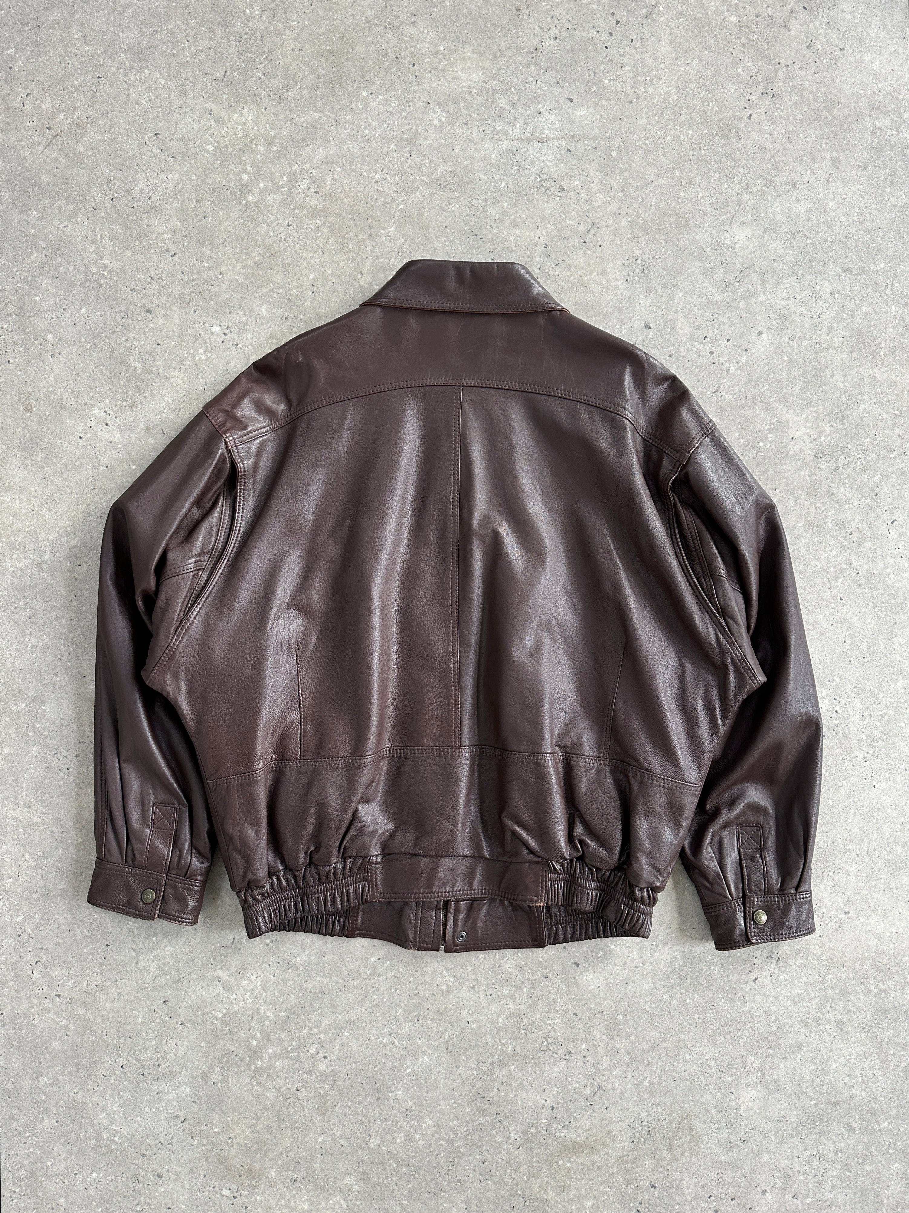 Jaeger 1980s leather bomber jacket in XL, featuring classic design, smooth leather, and ribbed cuffs and collar.