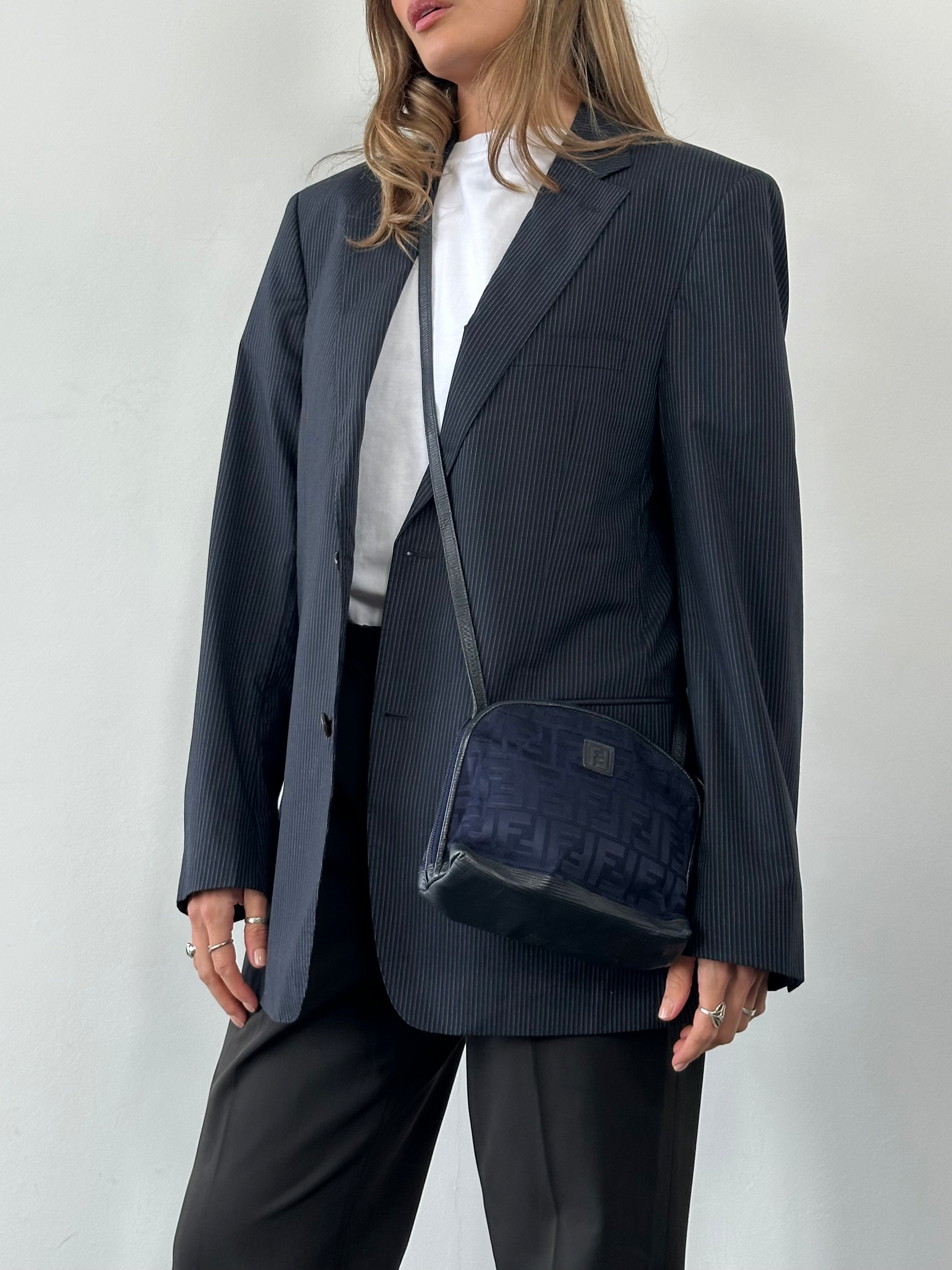 Fendi FF Monogram crossbody bag with adjustable strap and gold-tone hardware, featuring the signature Fendi logo pattern.