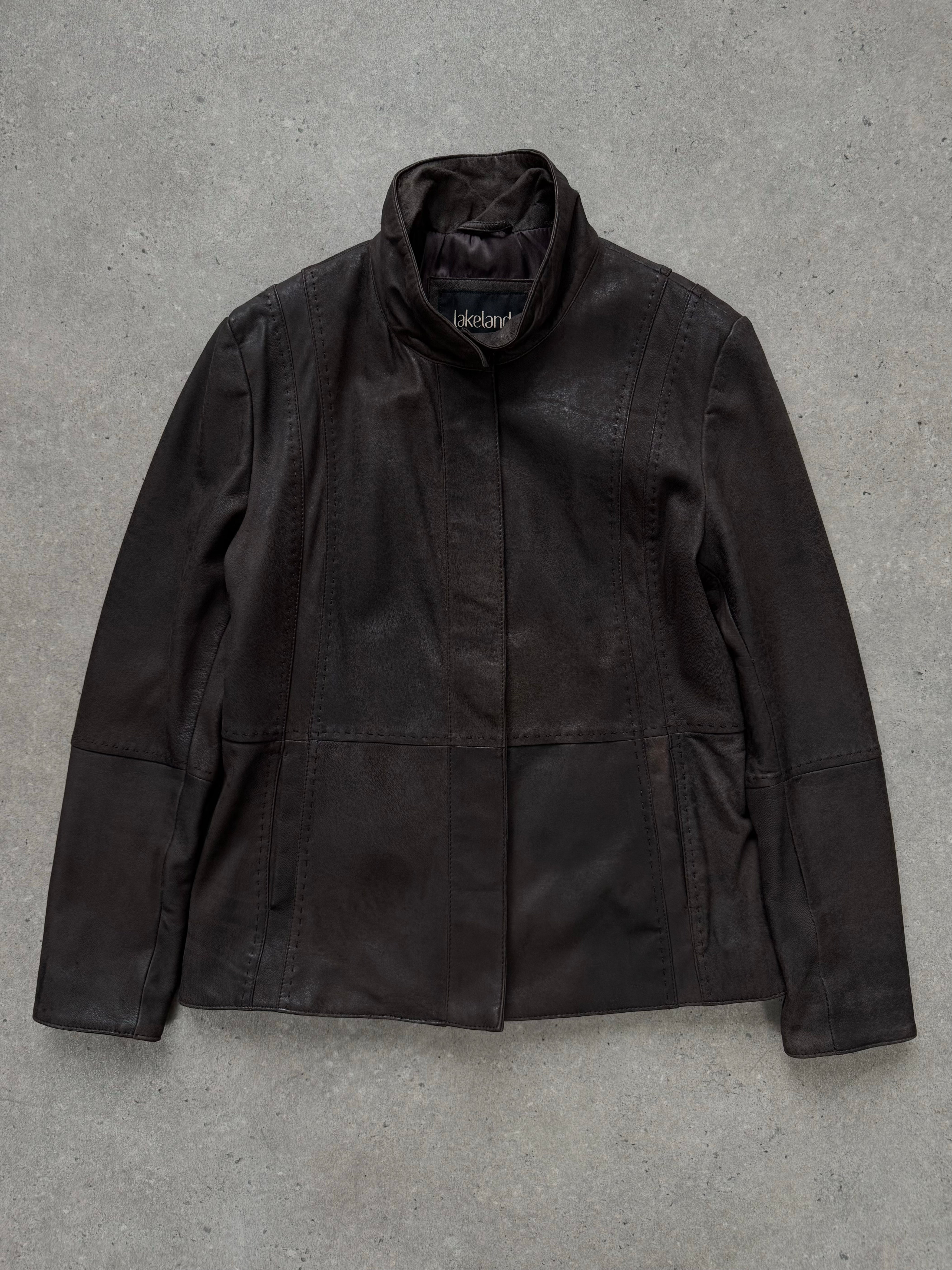 Vintage 1990s leather high neck jacket with long sleeves and front zipper, displayed on a hanger.