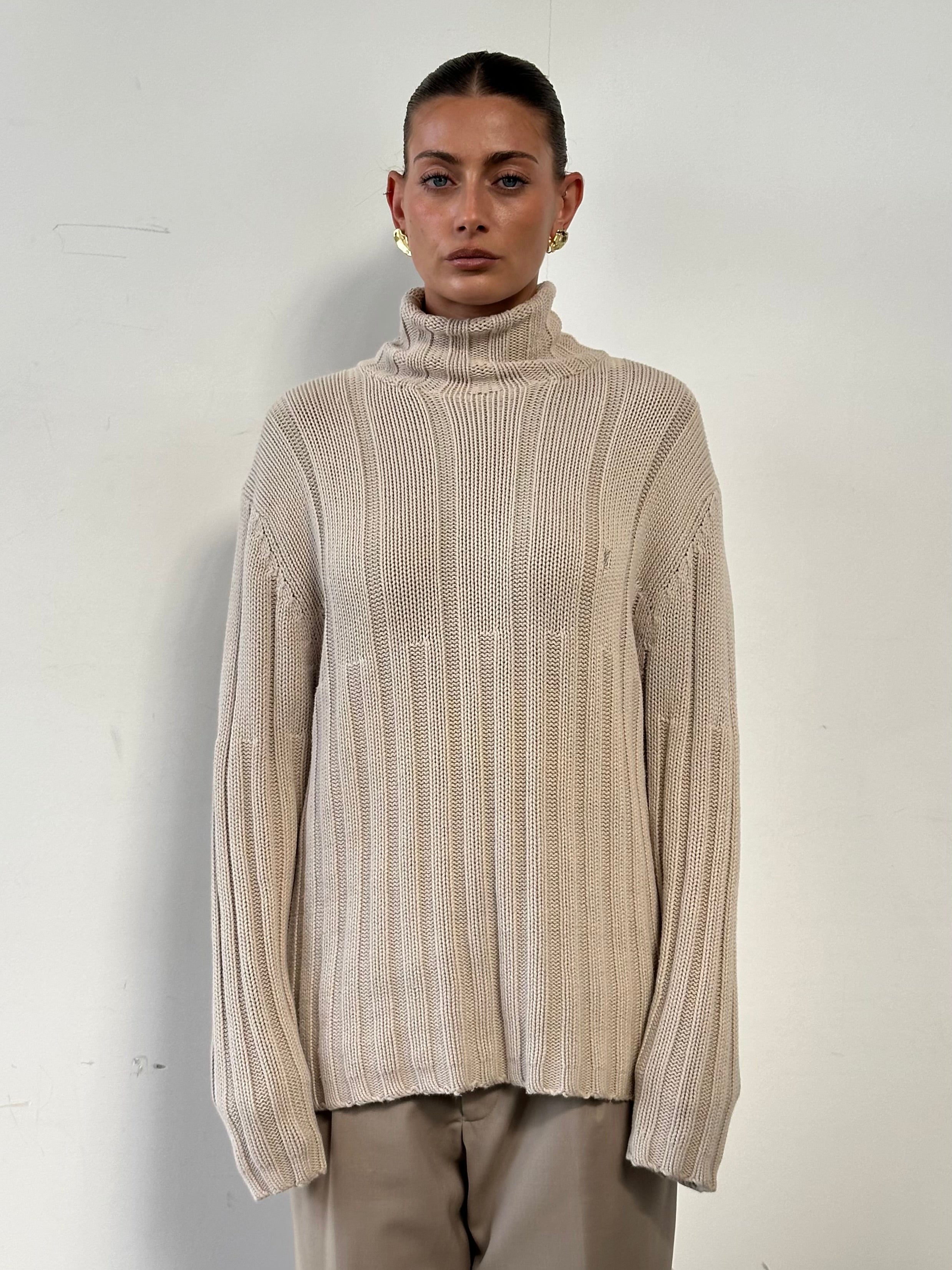 Yves Saint Laurent Pour Homme pure cotton logo roll neck jumper in XL, displaying the black knit fabric and subtle YSL branding.