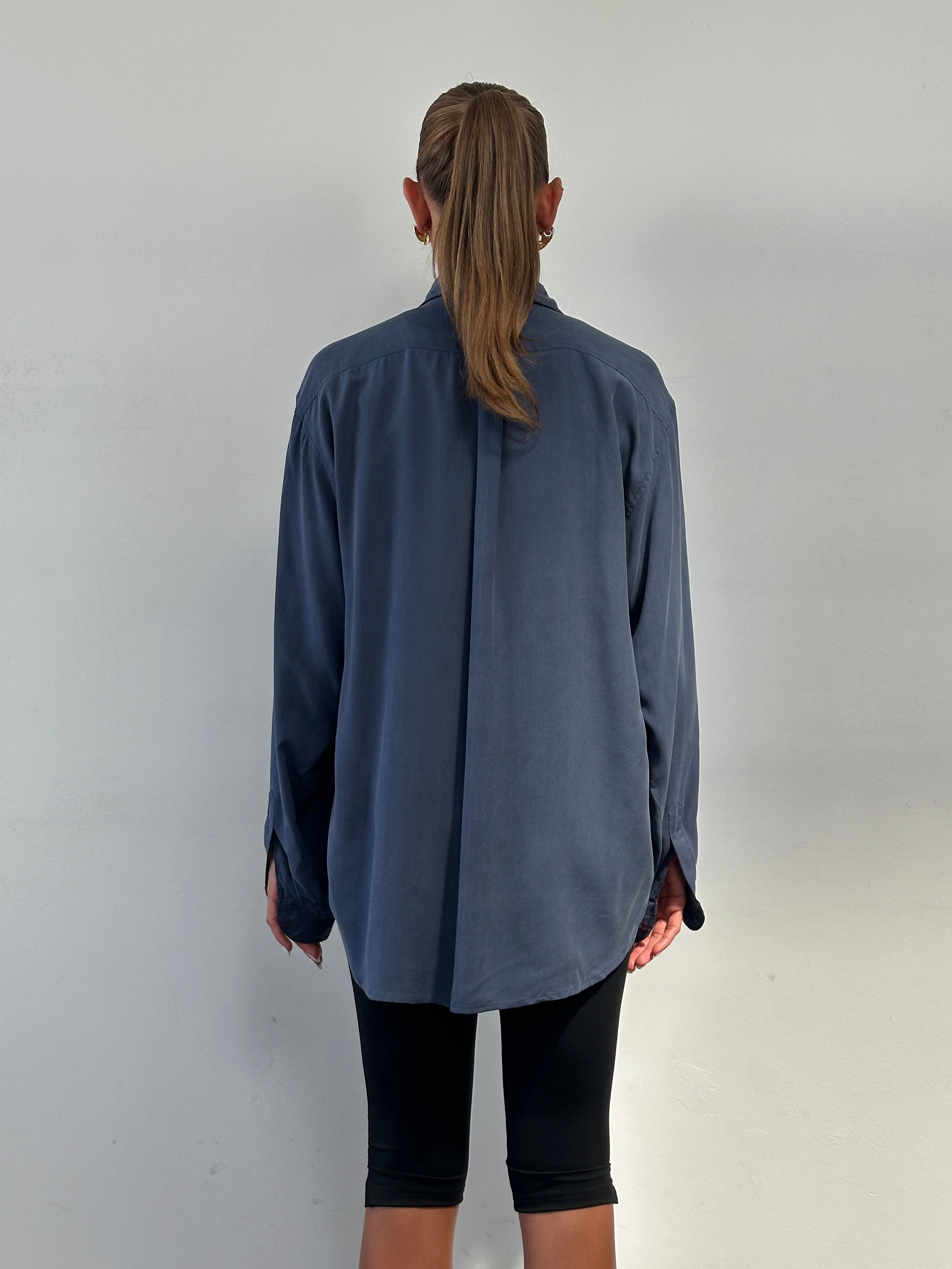 Vintage pure silk shirt in size XL, featuring a classic design with a smooth, shiny fabric and a relaxed fit.