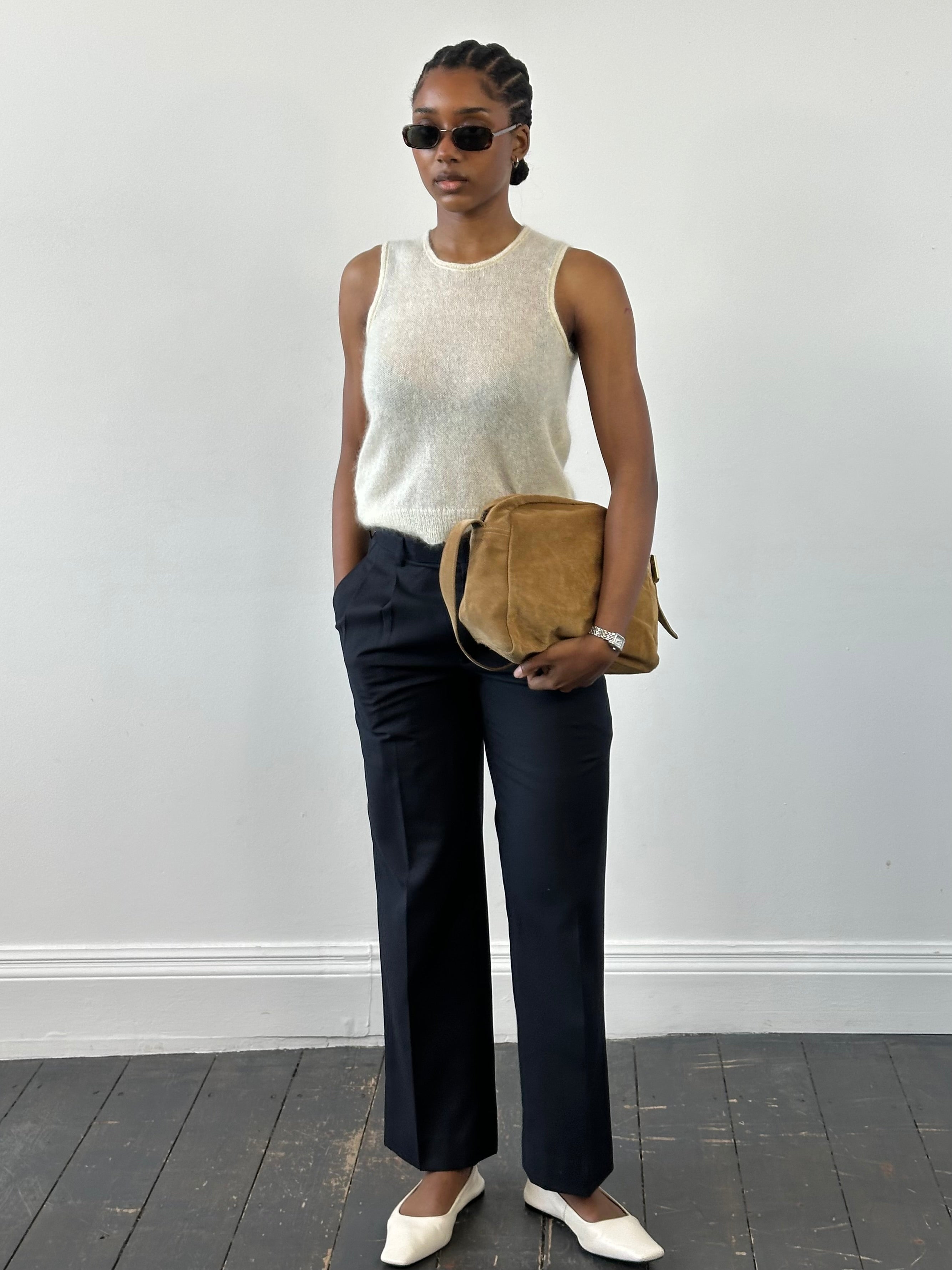 Vintage 2000s wool tailored trousers with pleats and straight leg fit, size W28, featuring classic tailored design.