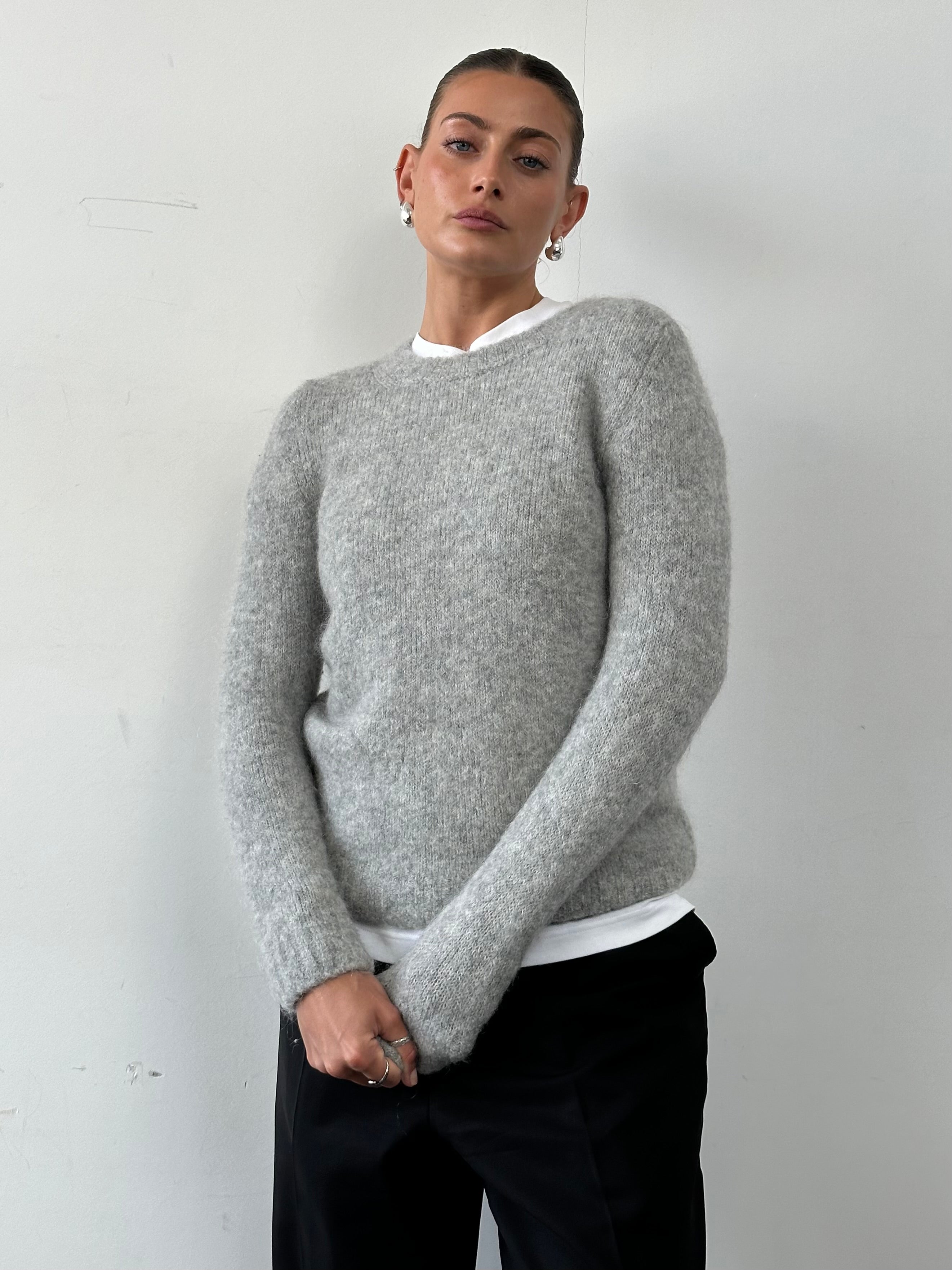 Max Mara Weekend mohair wool knit jumper in soft beige, showcasing its cozy, textured fabric and classic crew neckline.
