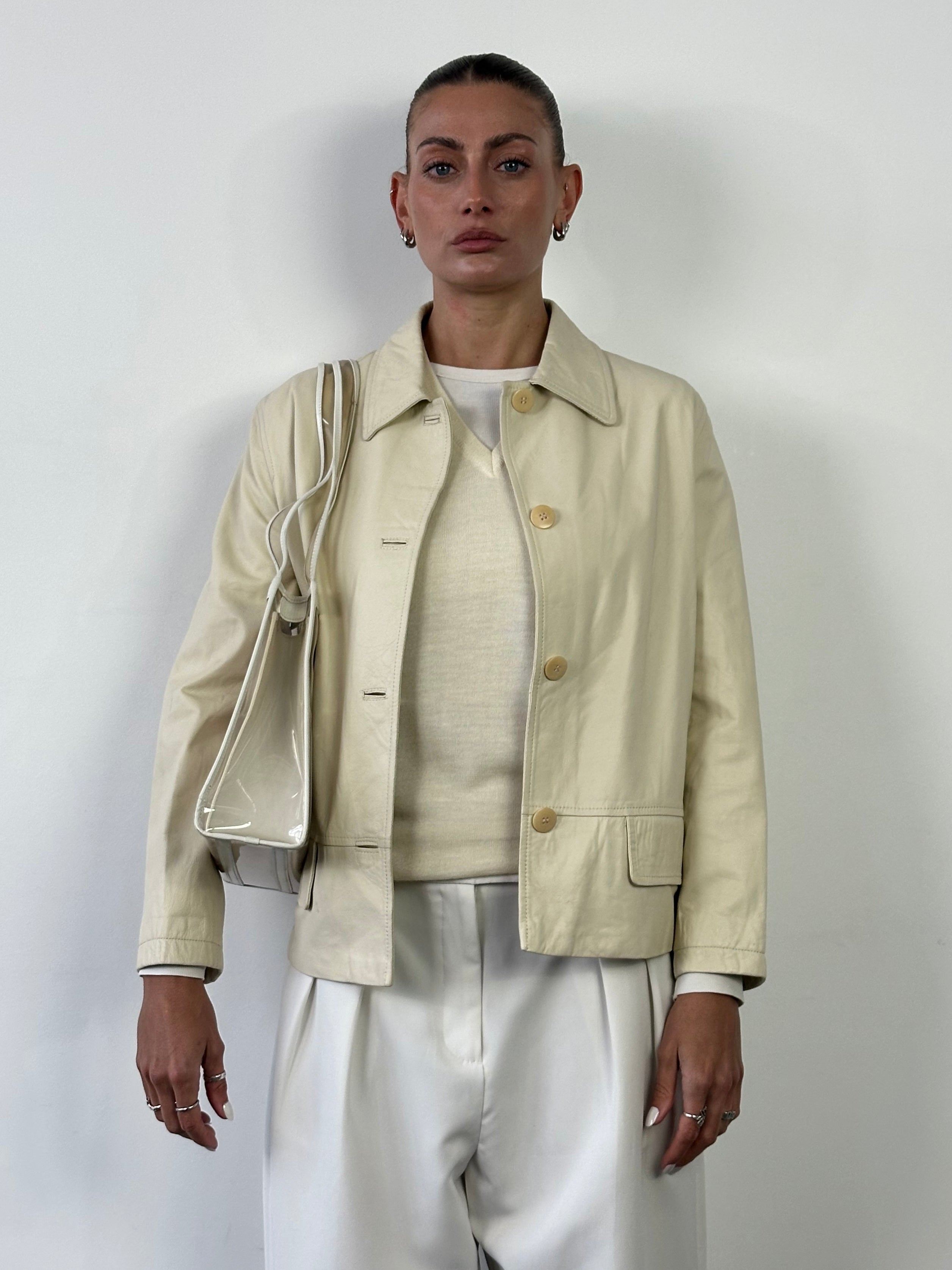 Burberry boxy leather jacket in black with structured design and silver zipper details, displayed on a hanger.