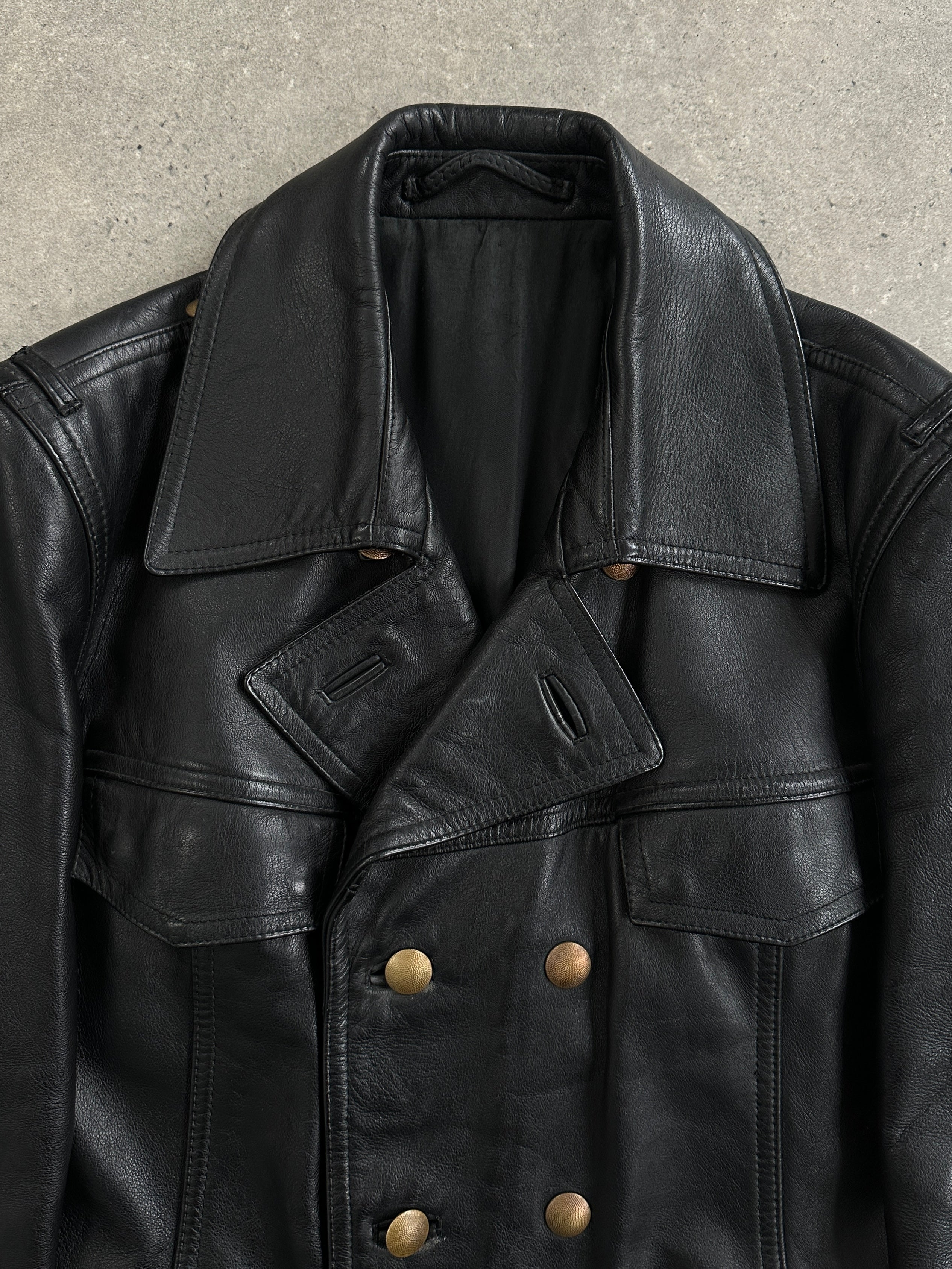 Vintage 1980s double-breasted military leather jacket with epaulets and patch pockets, size M/L, in rugged leather style.