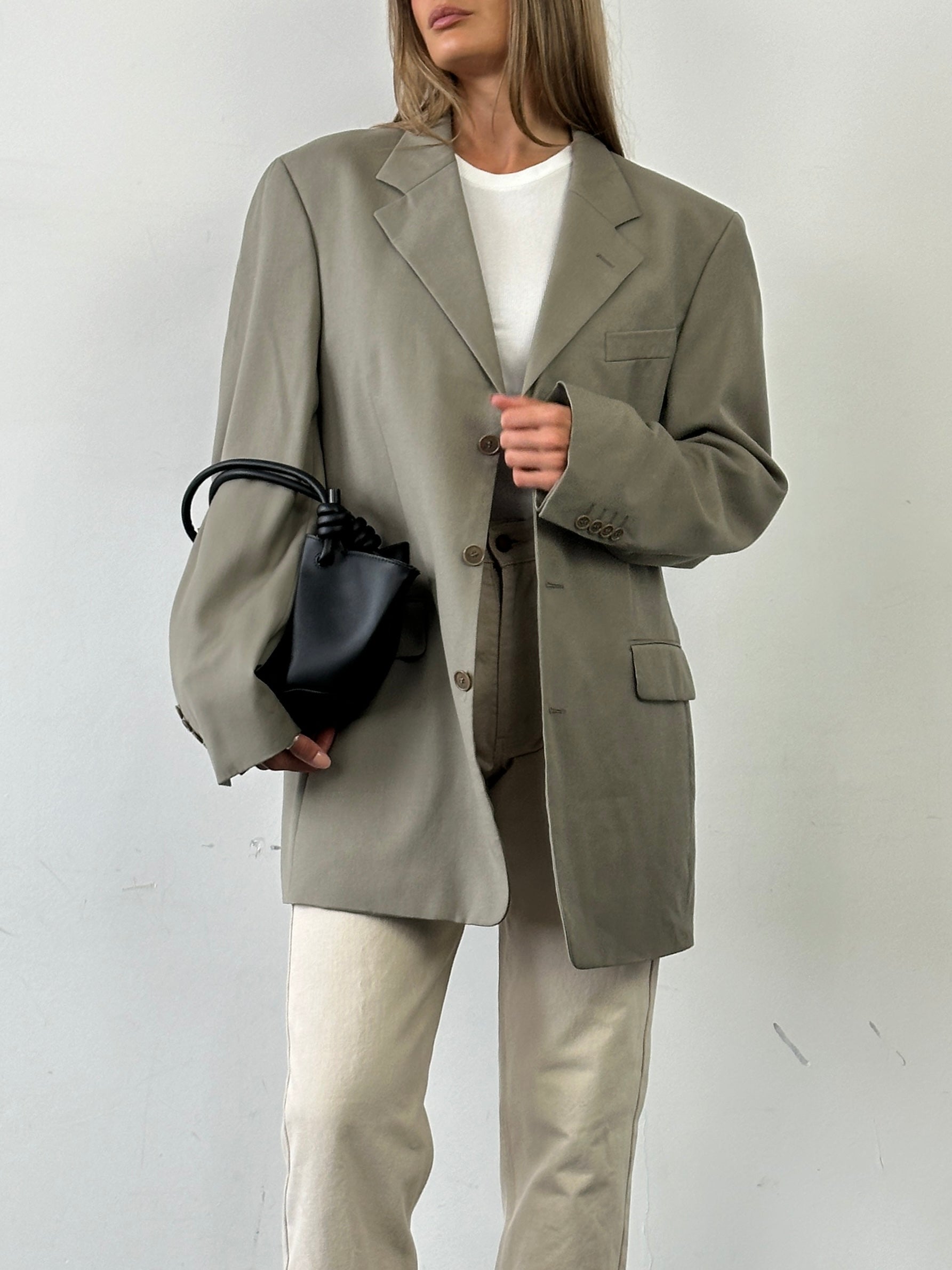 Yves Saint Laurent Pour Homme single-breasted wool blazer in XL, tailored fit with classic lapels and button closure.