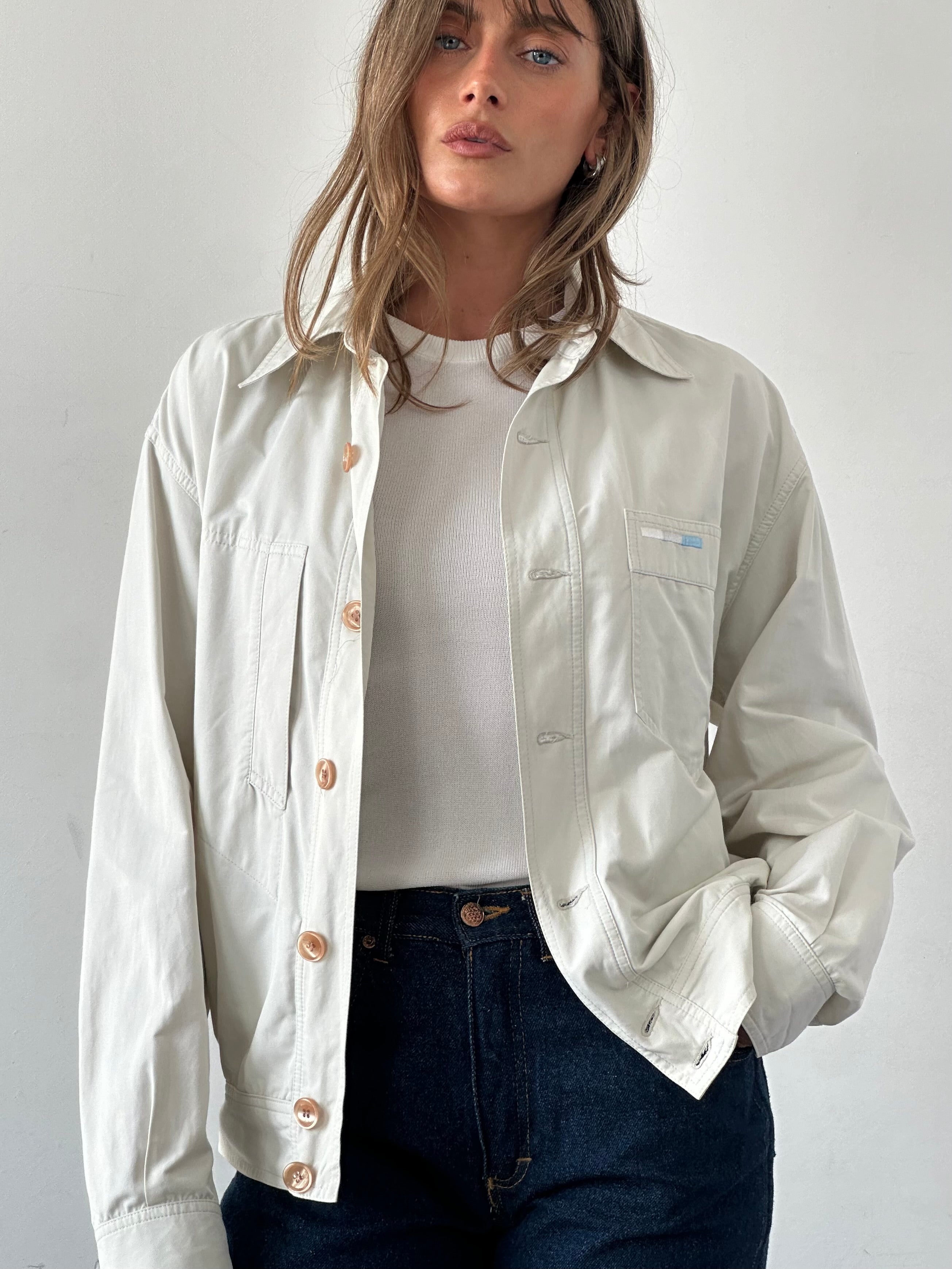Iceberg button-up bomber jacket in size M/L, featuring a sleek design and classic style, shown on a hanger.
