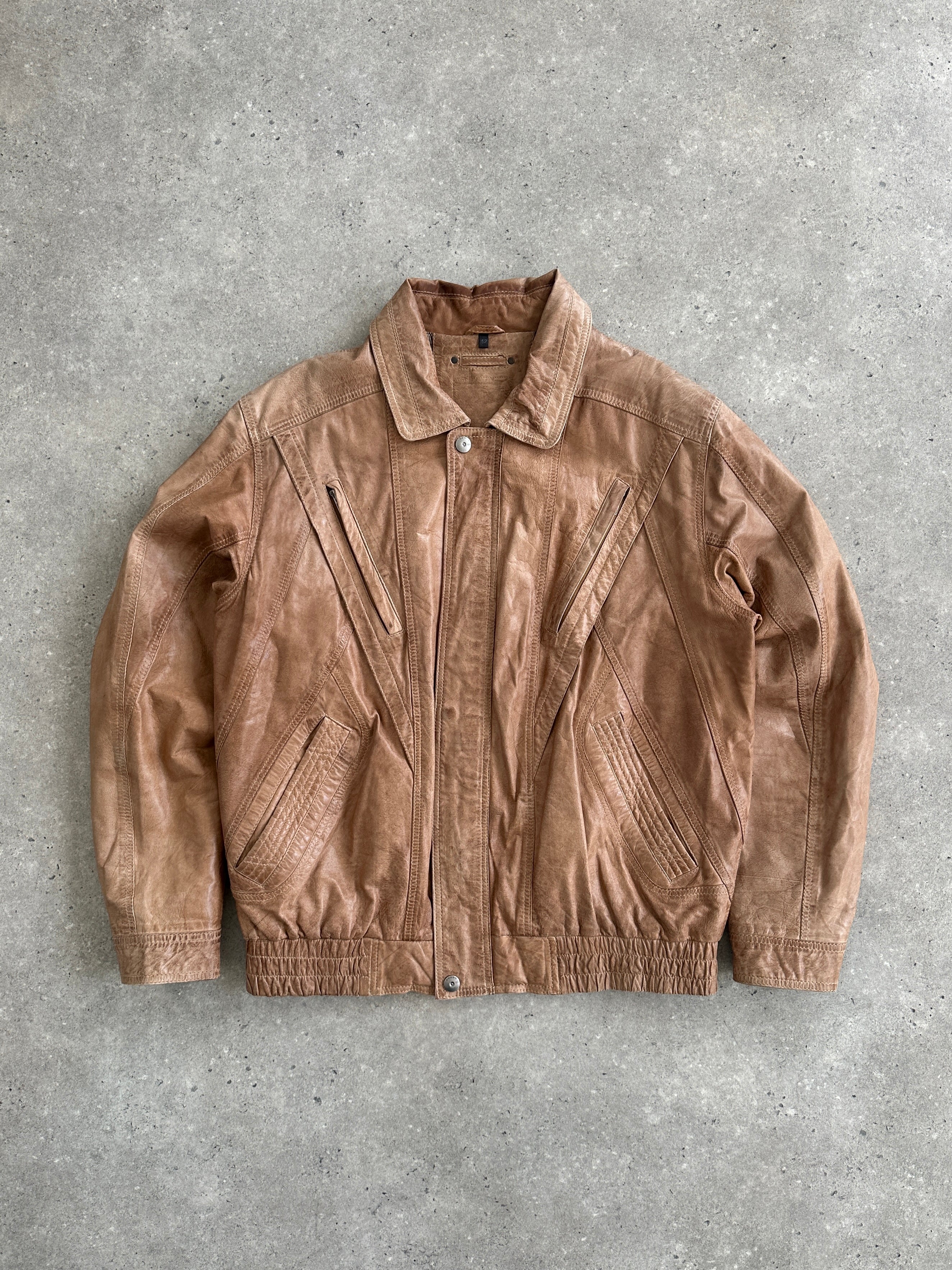 Vintage Leather Bomber Jacket from the 1990s, size large, featuring classic design and authentic leather material.