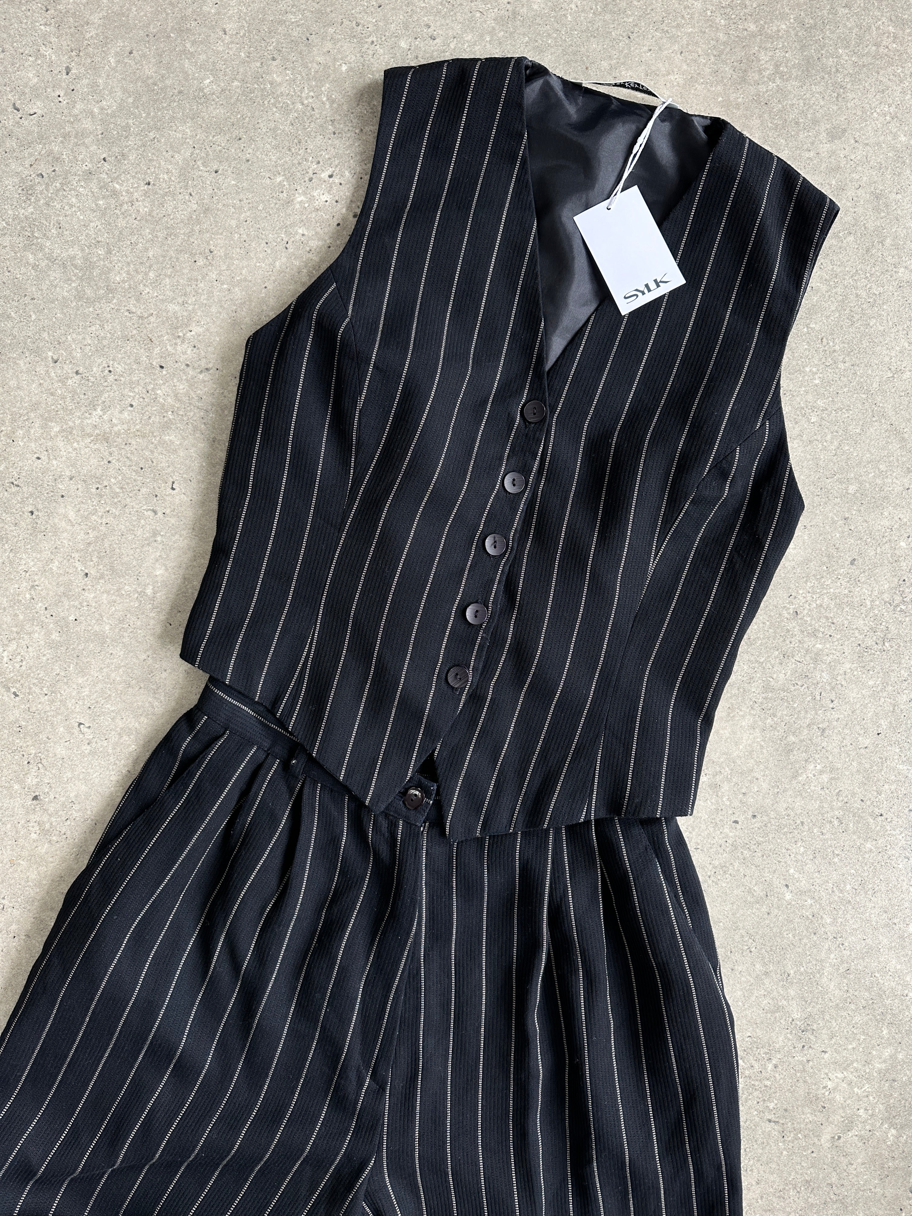 Vintage British vintage pinstripe two-piece waistcoat and trouser set, size M, classic tailored style with a refined pinstripe pattern.