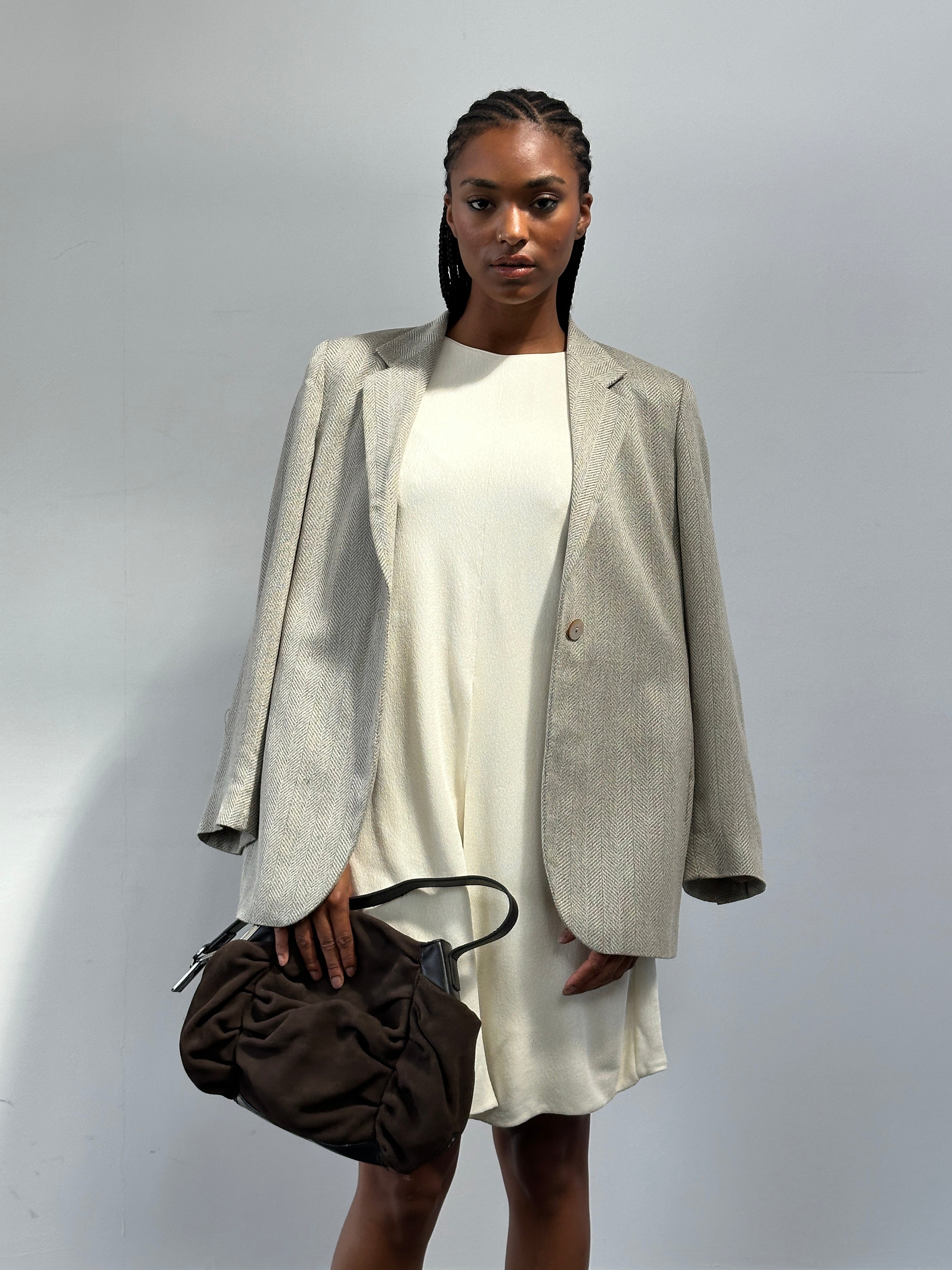 Max Mara relaxed single-button herringbone blazer in neutral tones, tailored fit with classic lapel and front pockets.