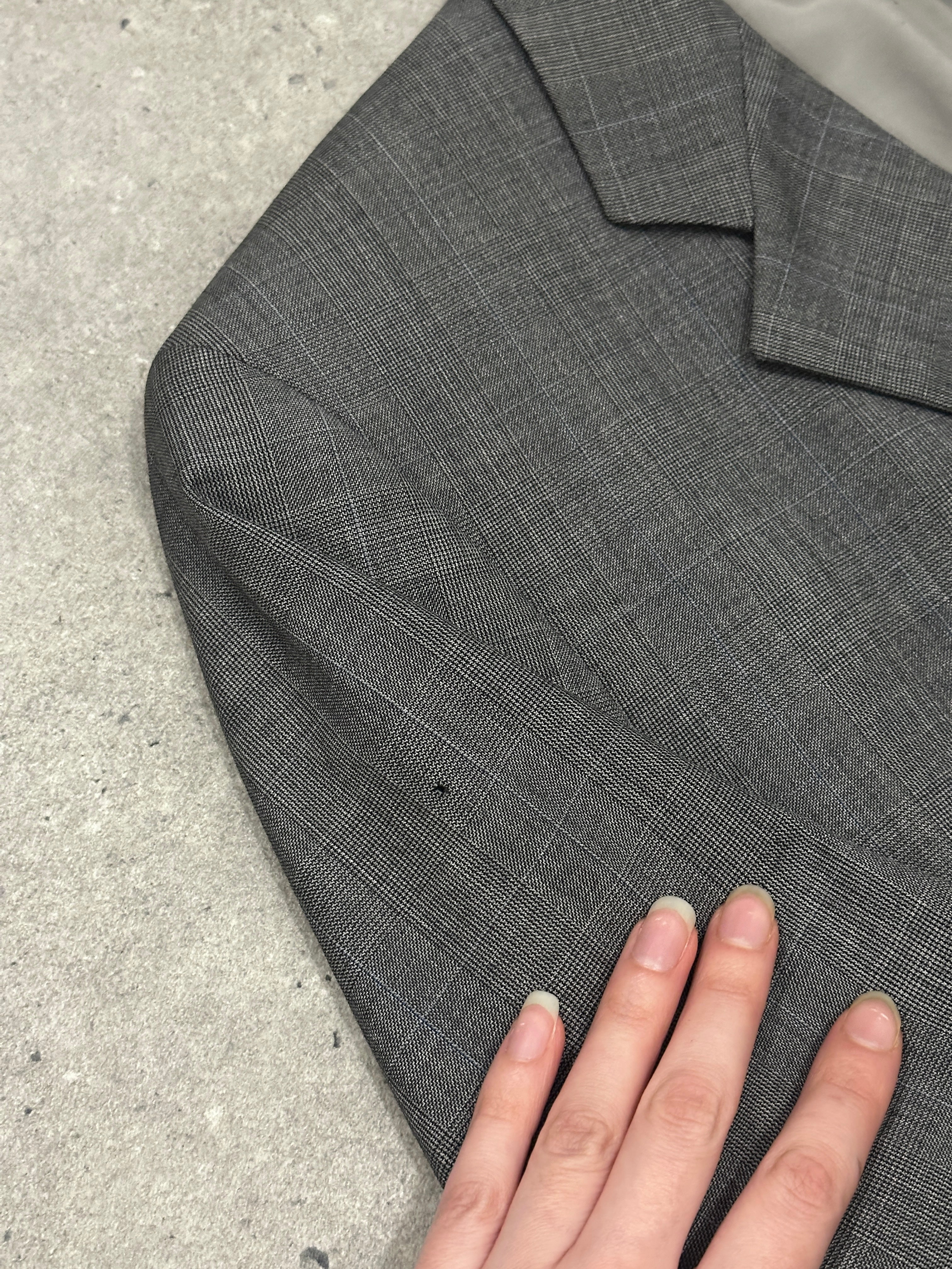 Yves Saint Laurent men's 1990s pure wool single-breasted blazer in size 40R/L, tailored fit with classic lapel and button closure.