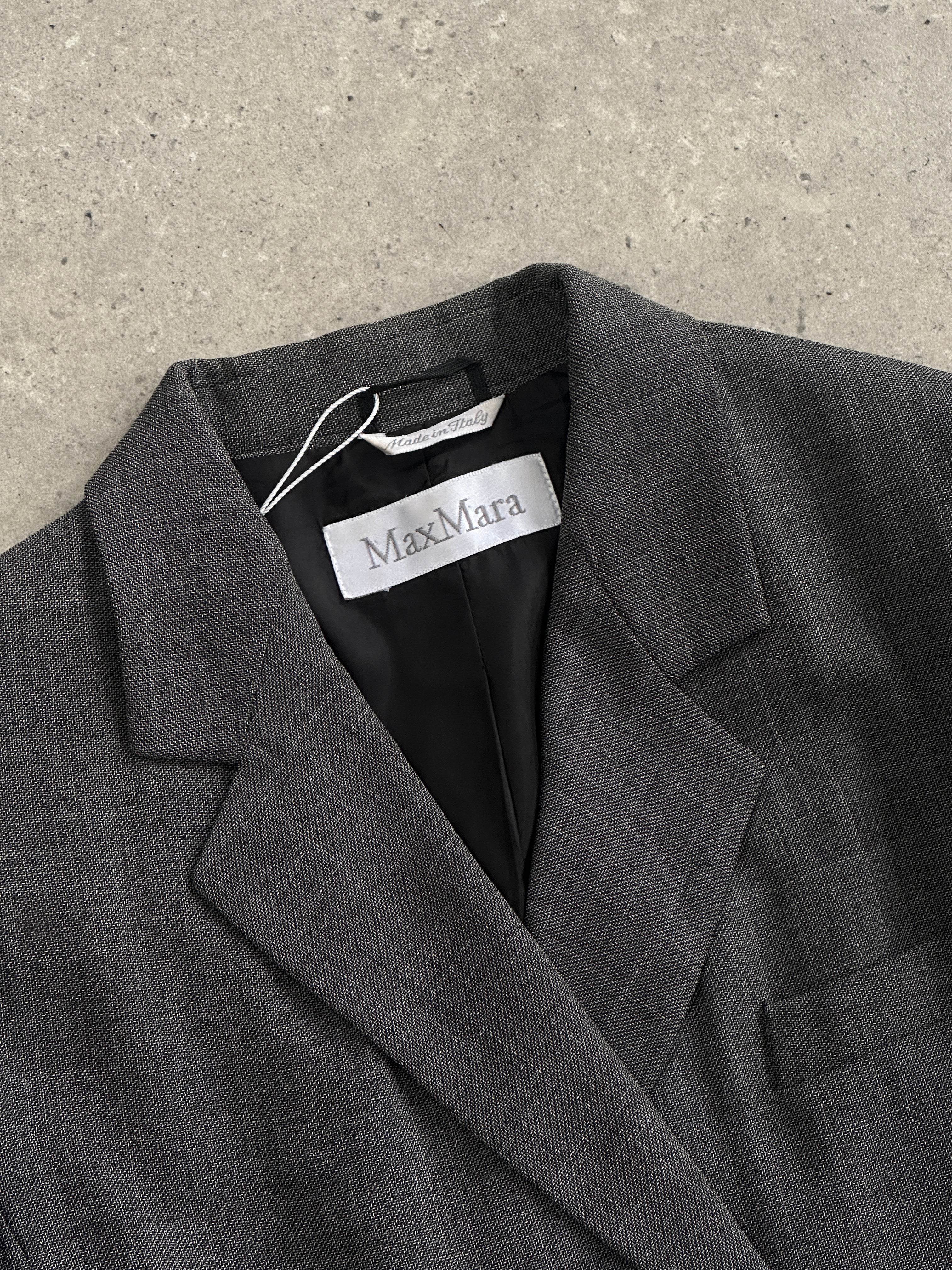 Max Mara wool double-breasted blazer in size S, tailored fit with classic lapels and structured design, shown on a neutral background.