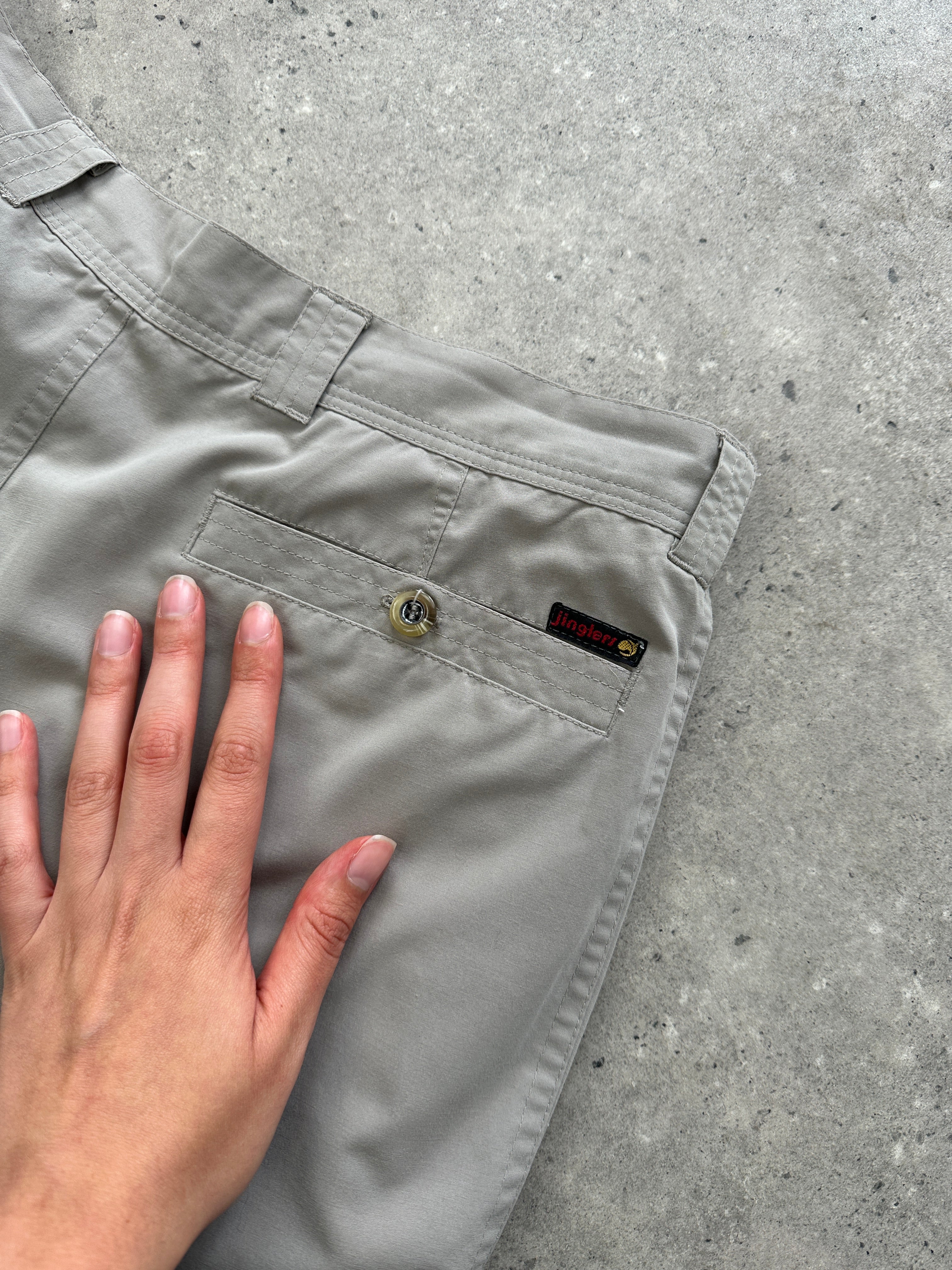 Vintage brand vintage straight leg pleated relaxed trousers in size W32, showing the fit and fabric texture