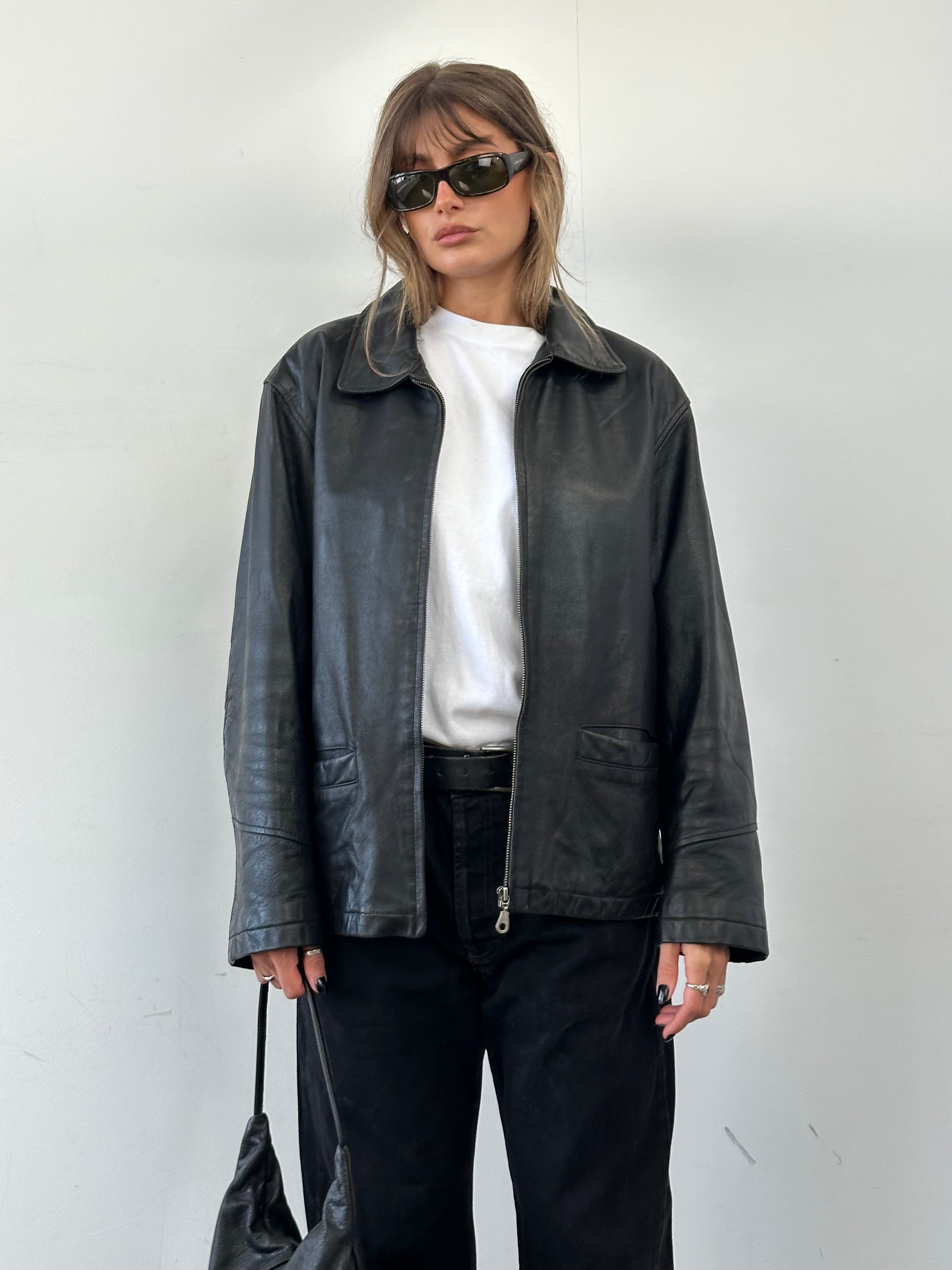 Vintage brand vintage leather bomber jacket in size XL, featuring classic design and distressed leather details.