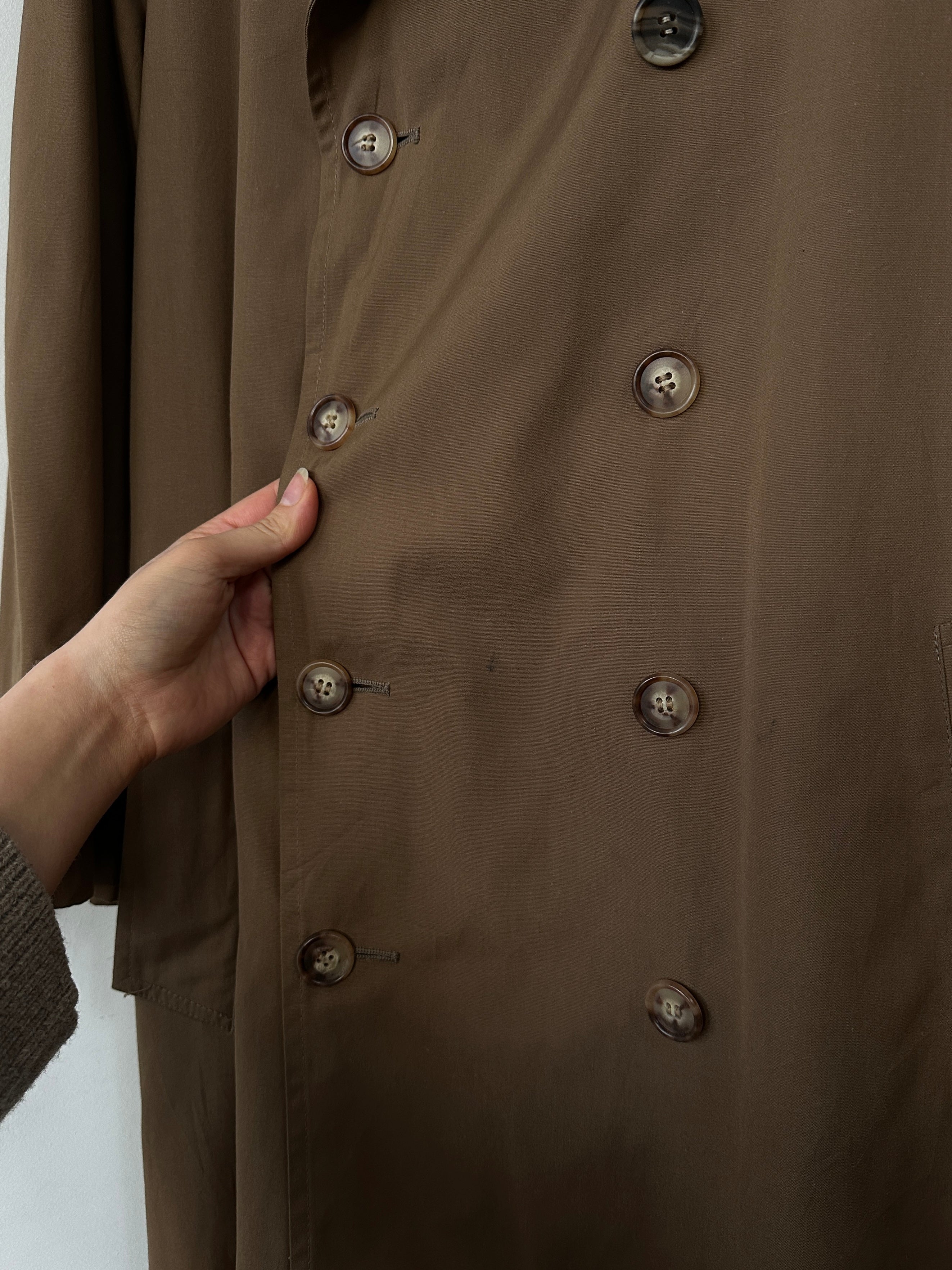 Christian Dior cotton double-breasted trench coat in size L, featuring classic design and stylish button details.
