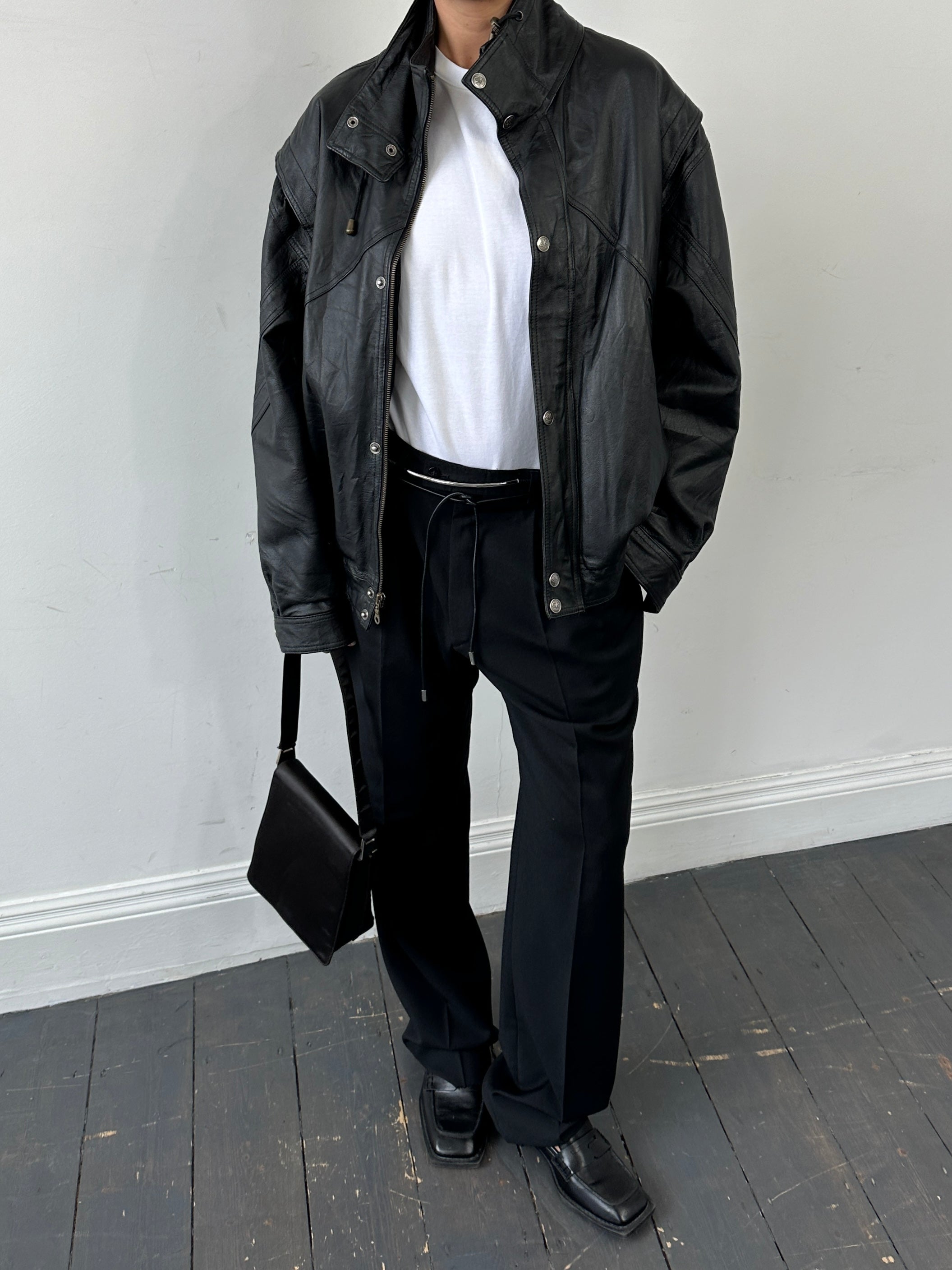 Vintage leather bomber jacket with funnel neck, size large, featuring classic design and durable brown leather material.