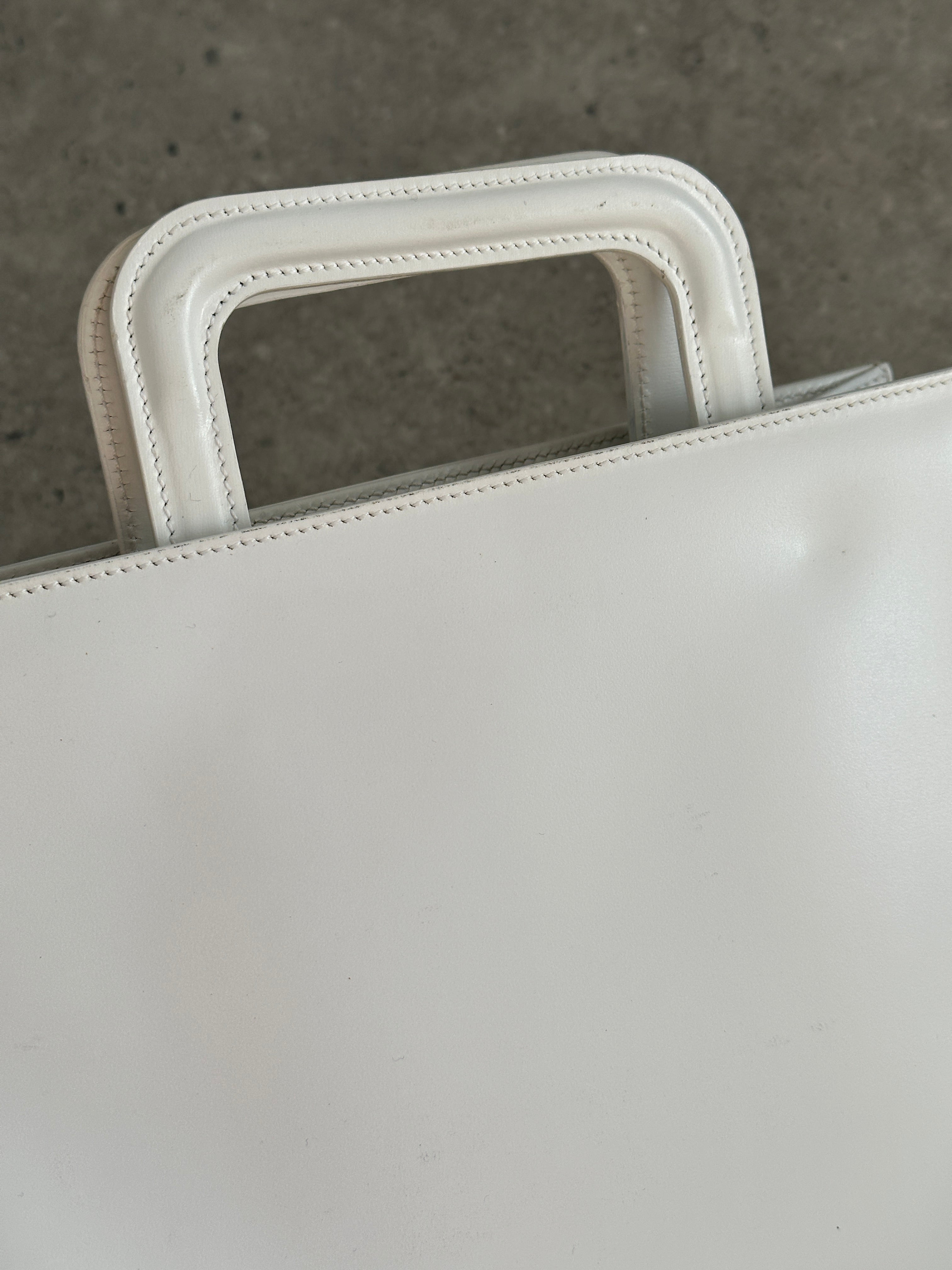 Gucci 1990s Tom Ford 2-in-1 leather and vinyl shoulder bag with adjustable strap and signature design details.