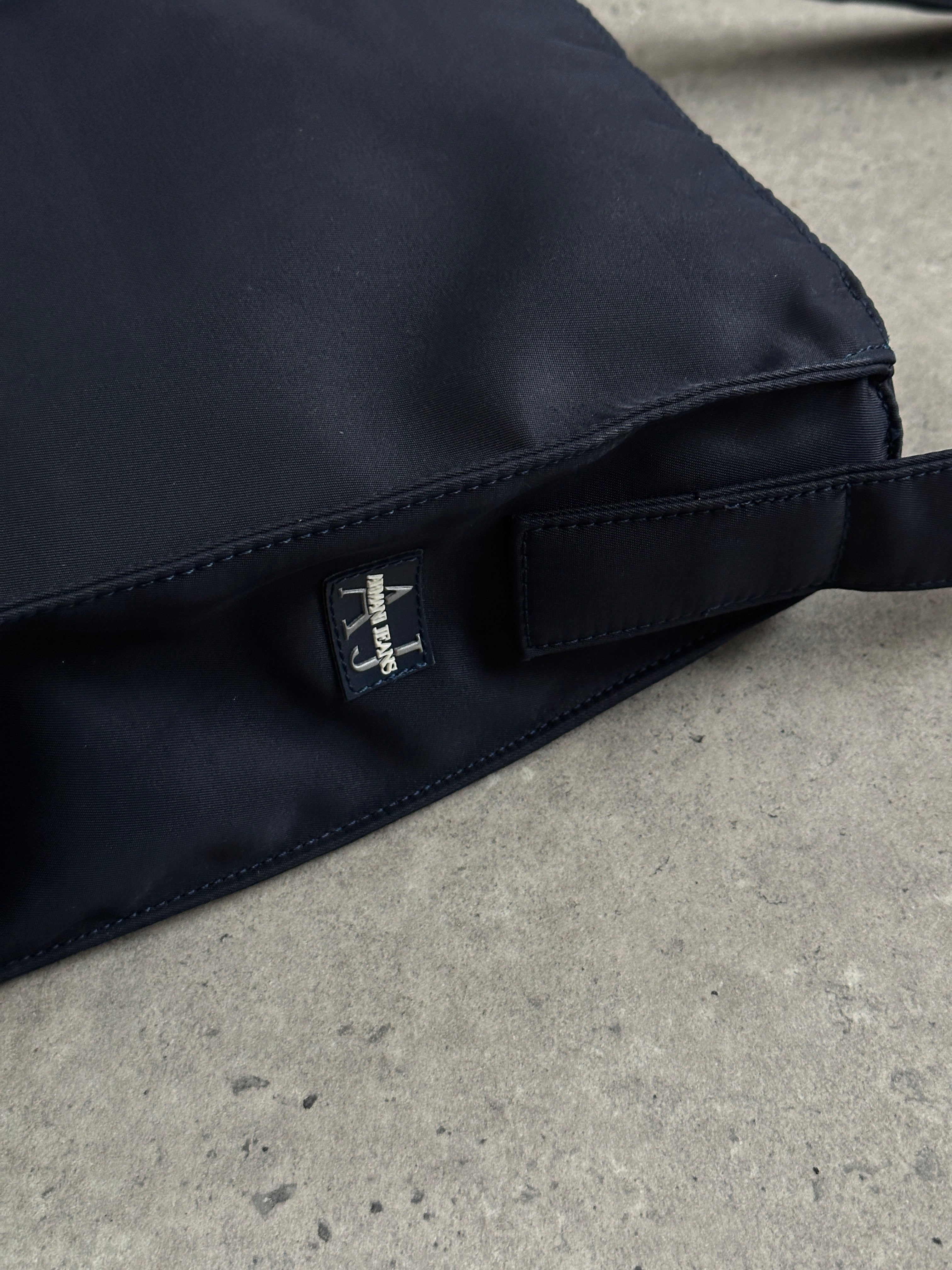 Armani Jeans 2000s nylon shoulder bag with adjustable strap and sleek design, featuring the Armani logo.