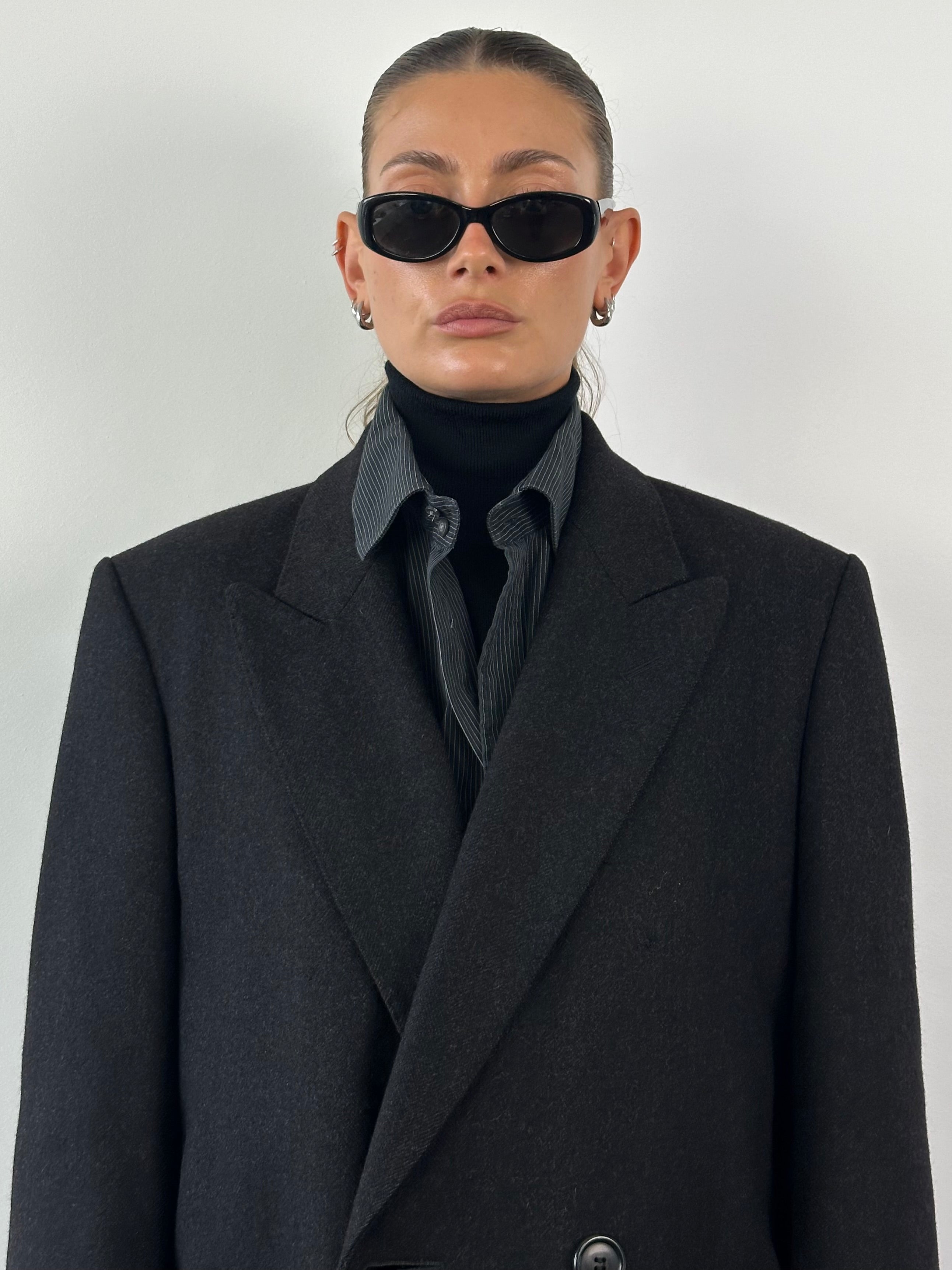Christian Dior pure wool double-breasted coat in size L/XL, featuring classic tailored design and elegant lapels.