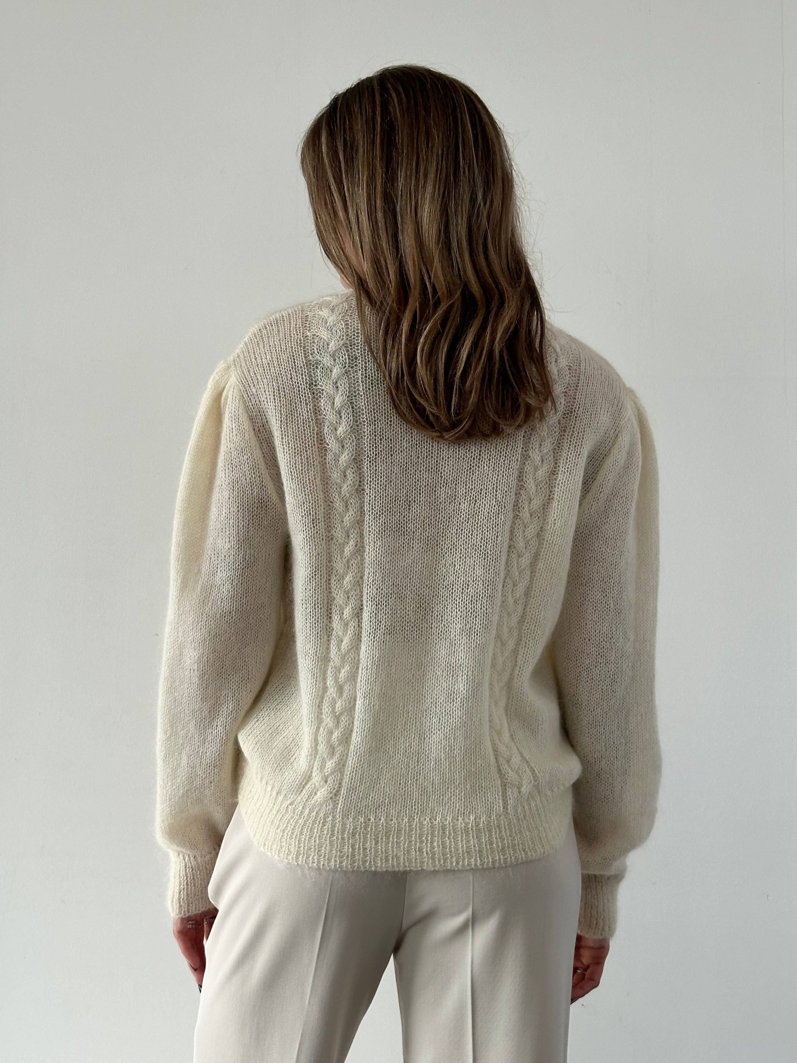 Vintage wool mohair cardigan in size L, featuring a cozy, textured knit with button closure and ribbed cuffs.