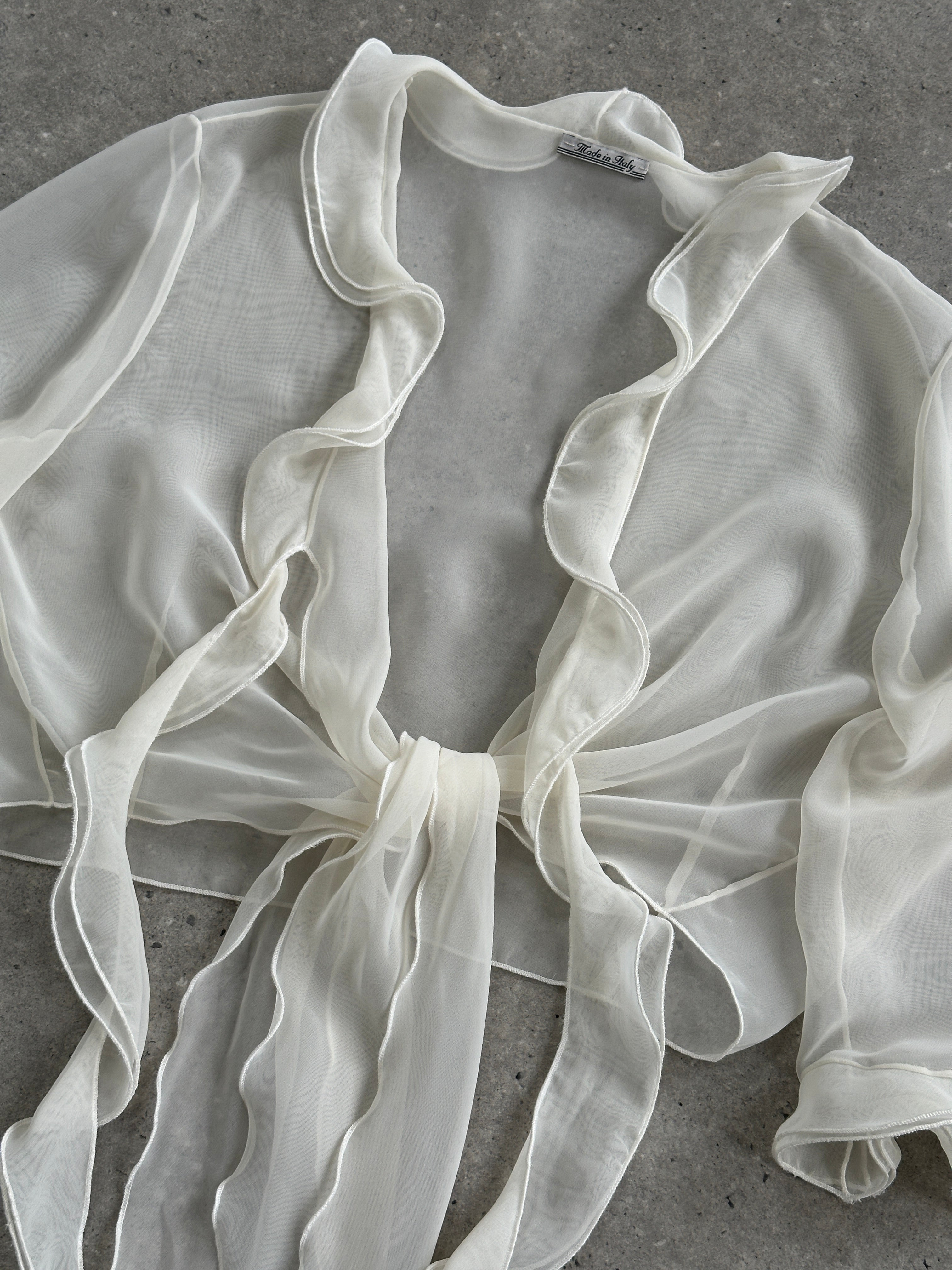 Vintage Italian sheer frill tie-front blouse in size S to XL, featuring lightweight fabric and feminine ruffle details.