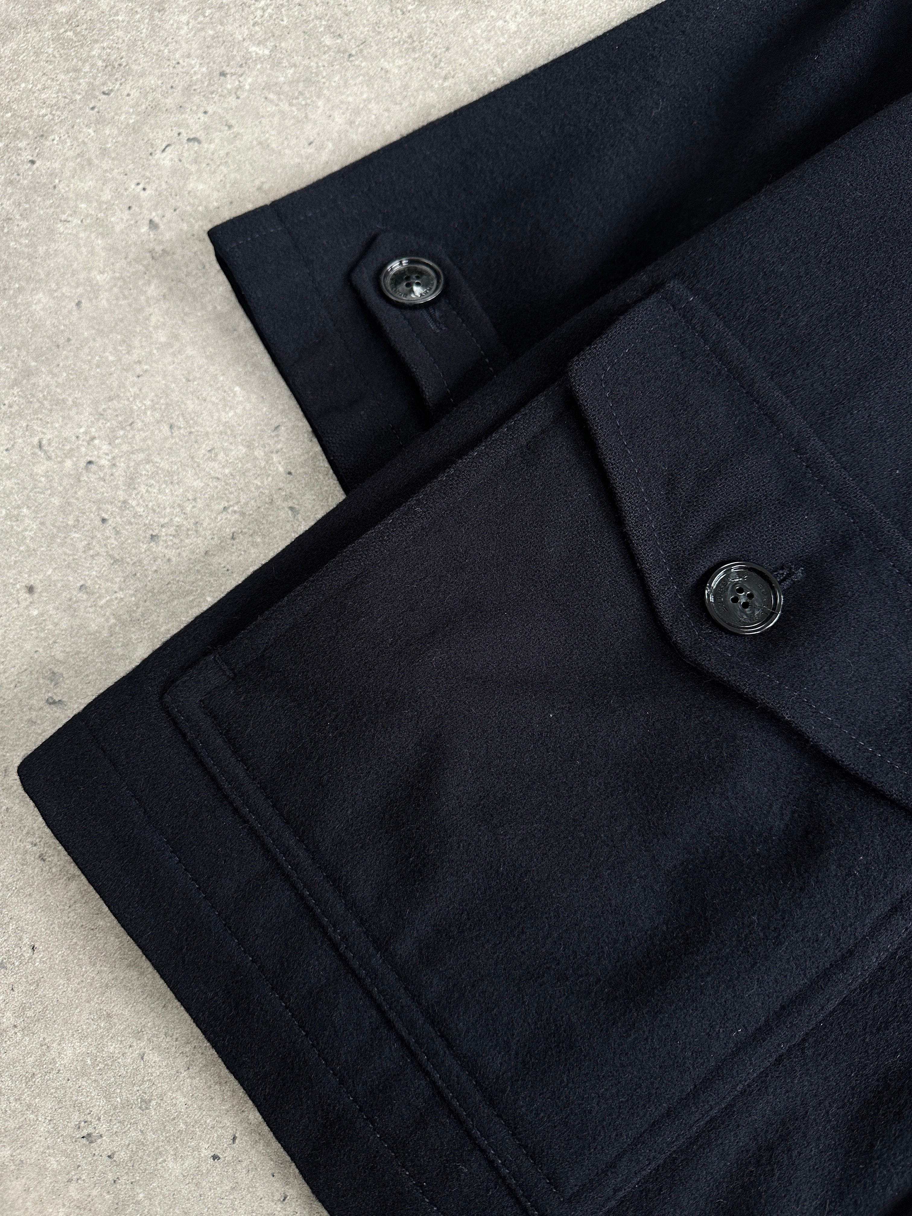 Burberry London 1990s wool single-breasted logo coat in size L/XL, featuring classic design and signature check pattern.