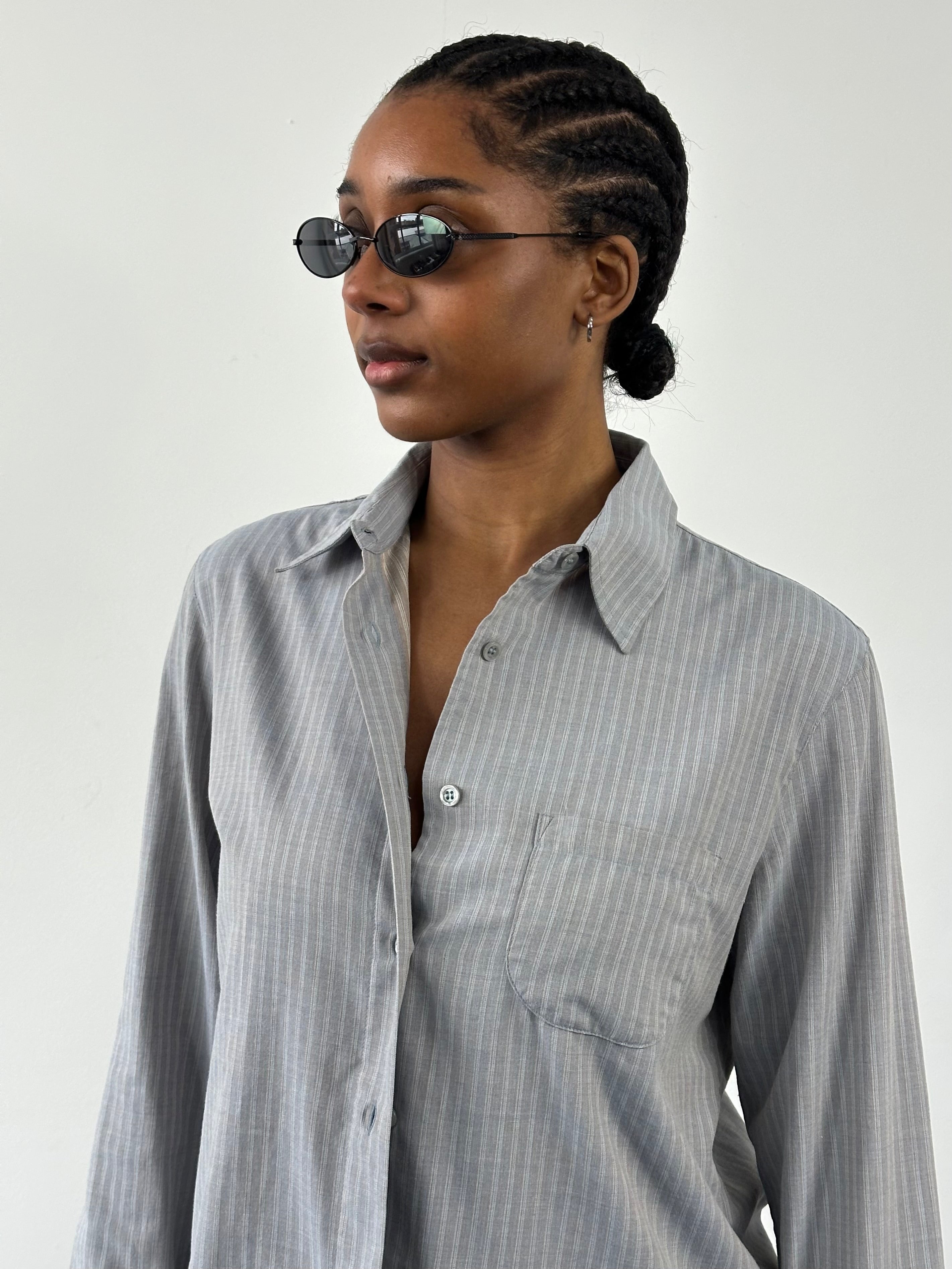 Armani Jeans 2000s striped logo shirt in size M, featuring a classic design with bold stripes and the Armani logo on the chest.