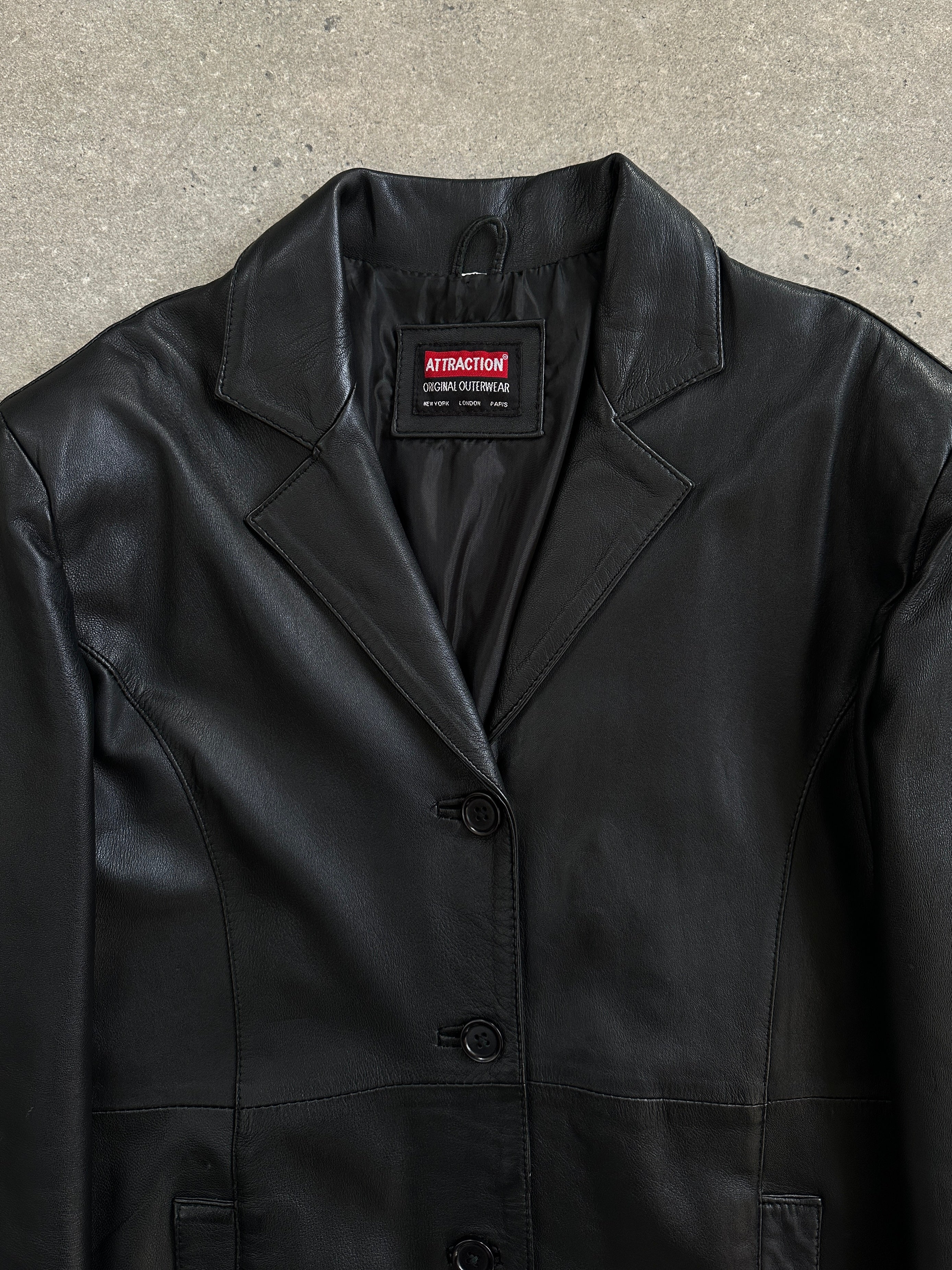 Vintage 1990s floor-length leather trench coat in black, stylish vintage leather jacket with classic design and wide lapels.