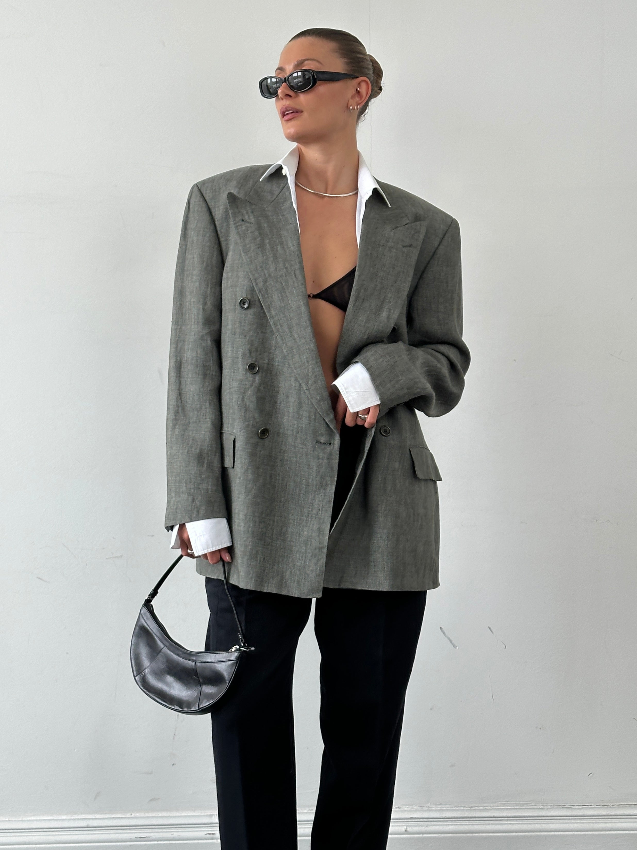 Hugo Boss pure linen double-breasted blazer with large lapels in size 40R/XL, shown on a hanger.