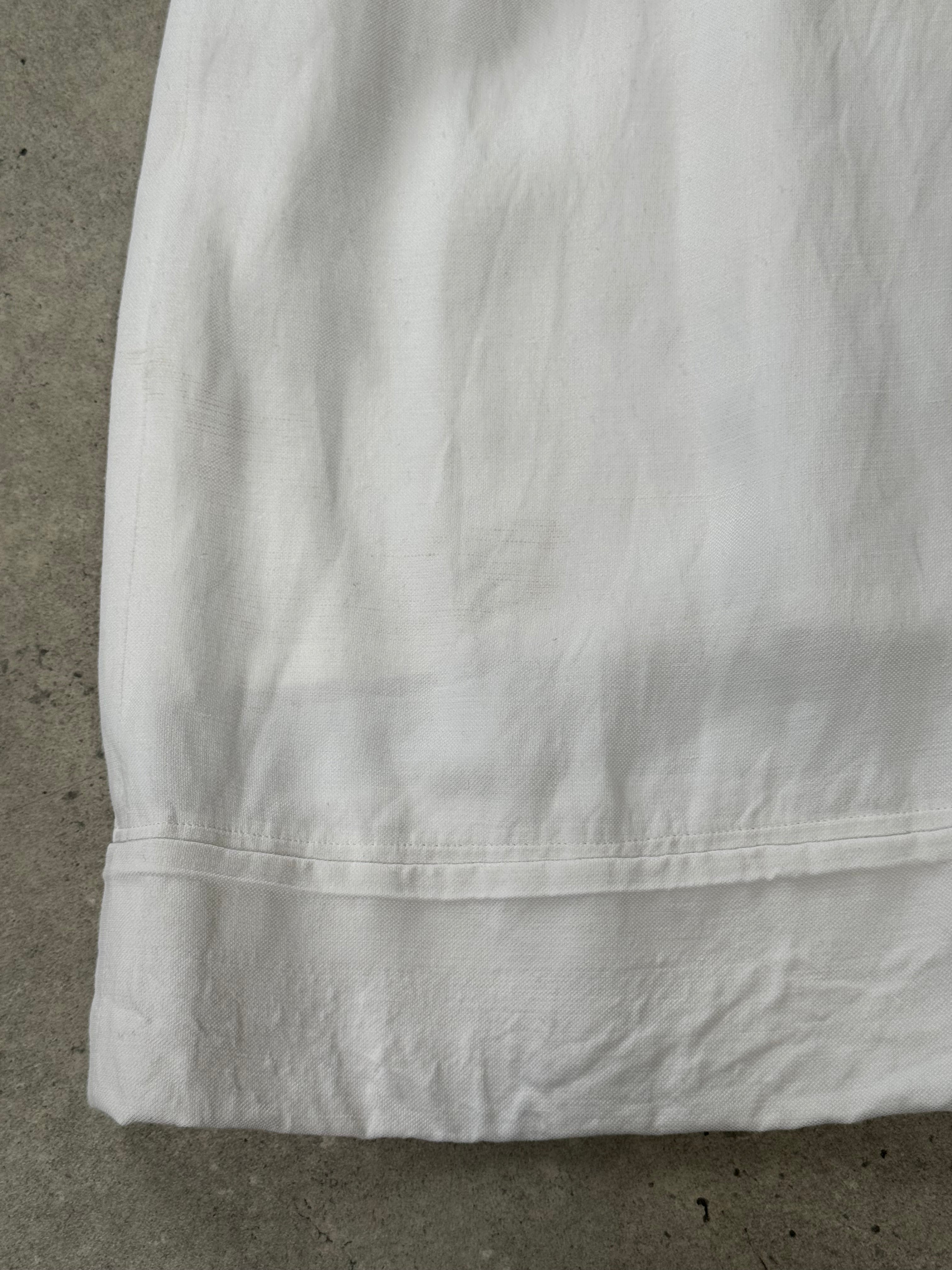 Vintage Japanese 1990s high-waisted wide-leg culottes shorts in W26, showcasing retro fabric and relaxed fit.