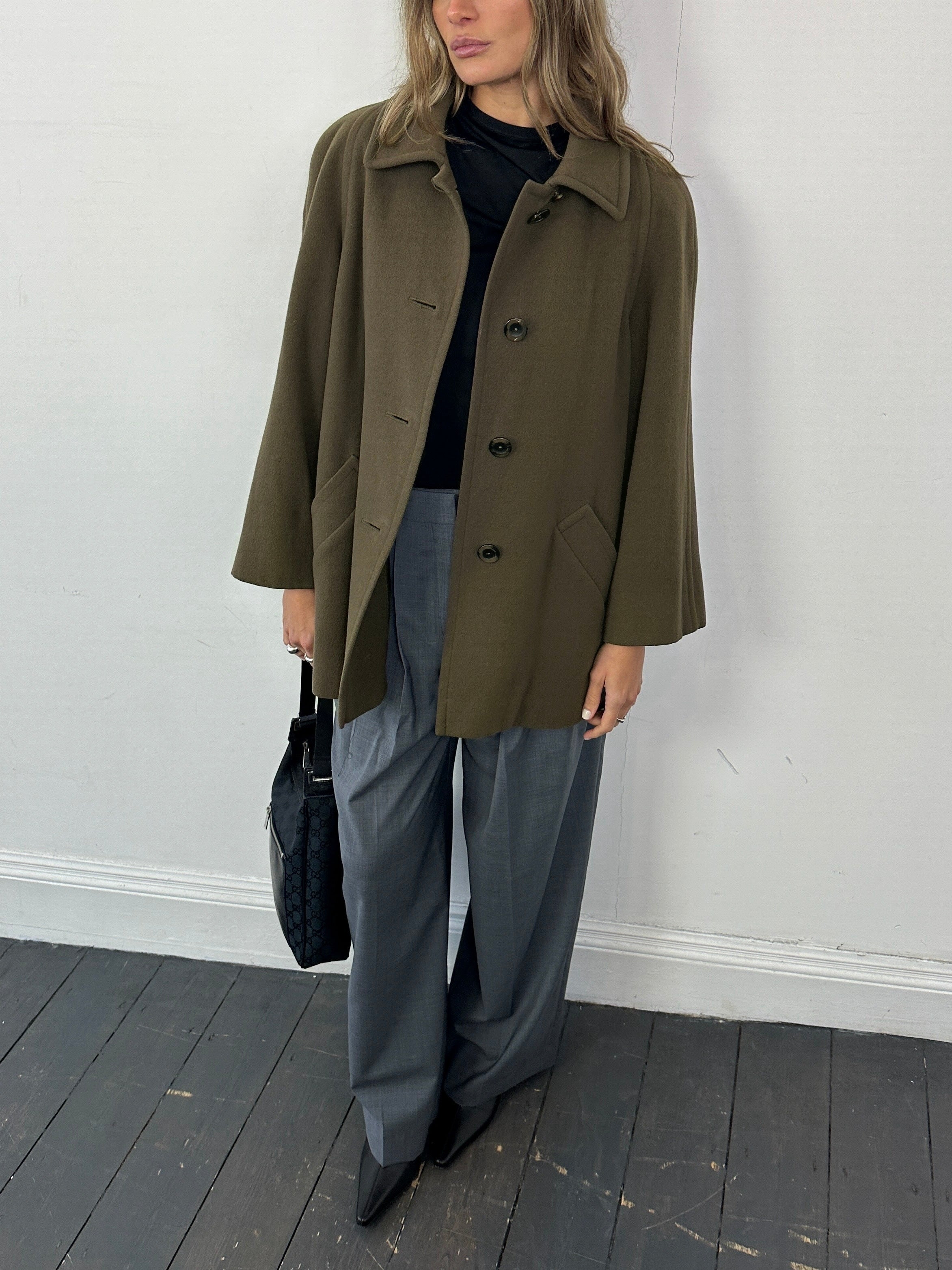 Aquascutum pure new wool coat in size M showcasing classic tailored design and luxurious fabric.