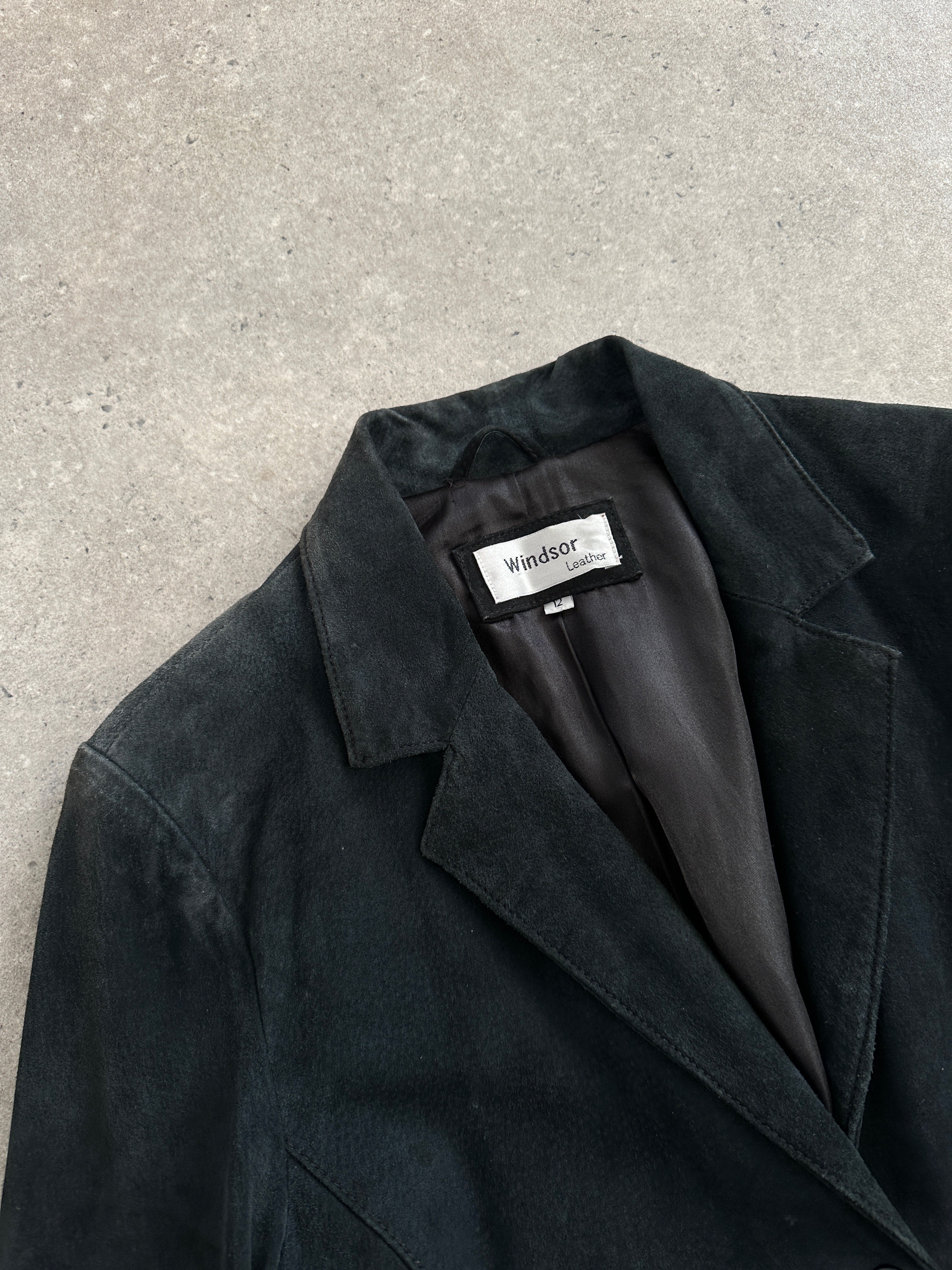 Vintage 1990s suede belted leather jacket in size S/M with classic design and front buckle details.