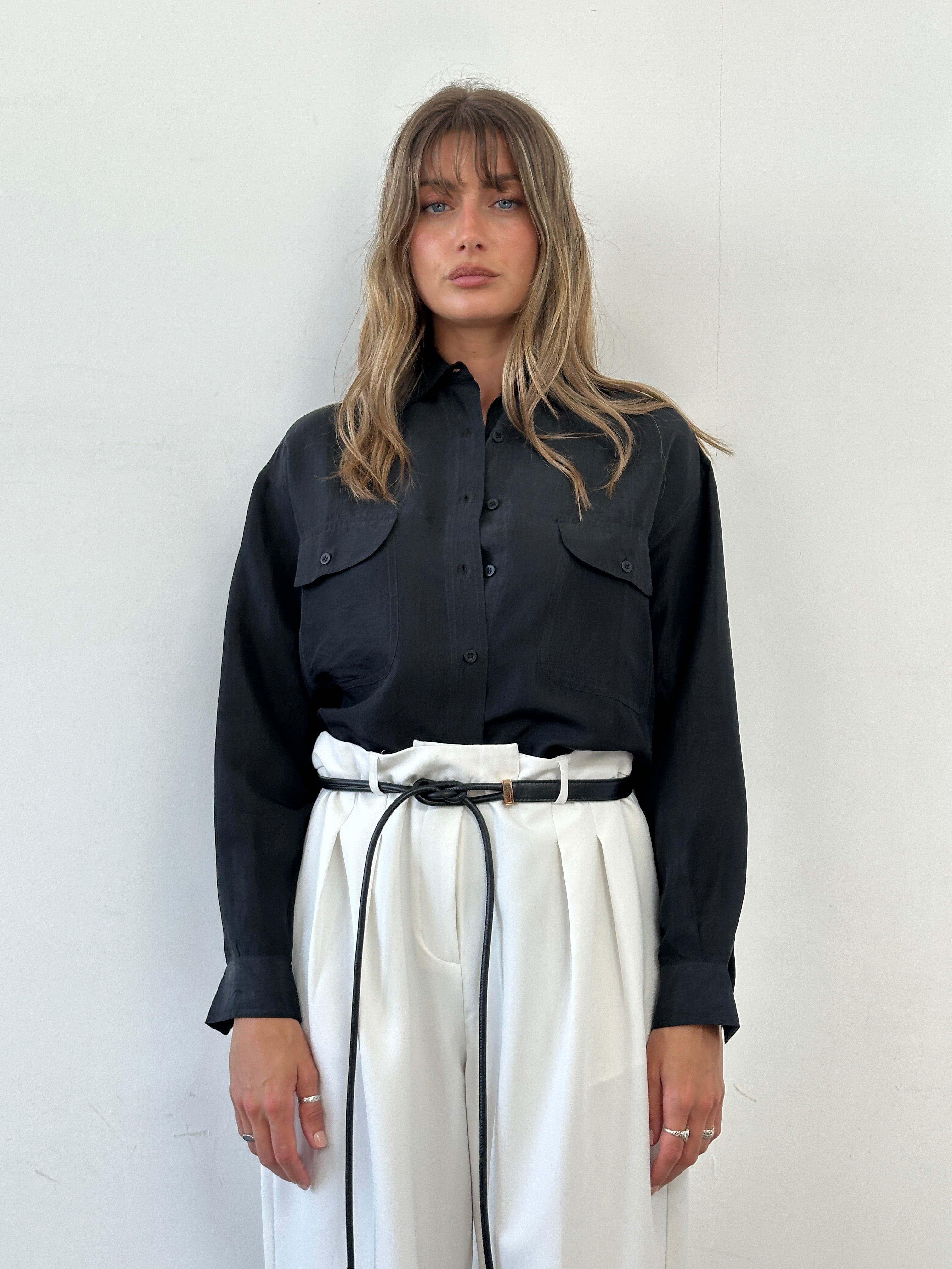 Vintage Italian pure silk shirt in size M, featuring elegant design and smooth fabric, displayed on a hanger.