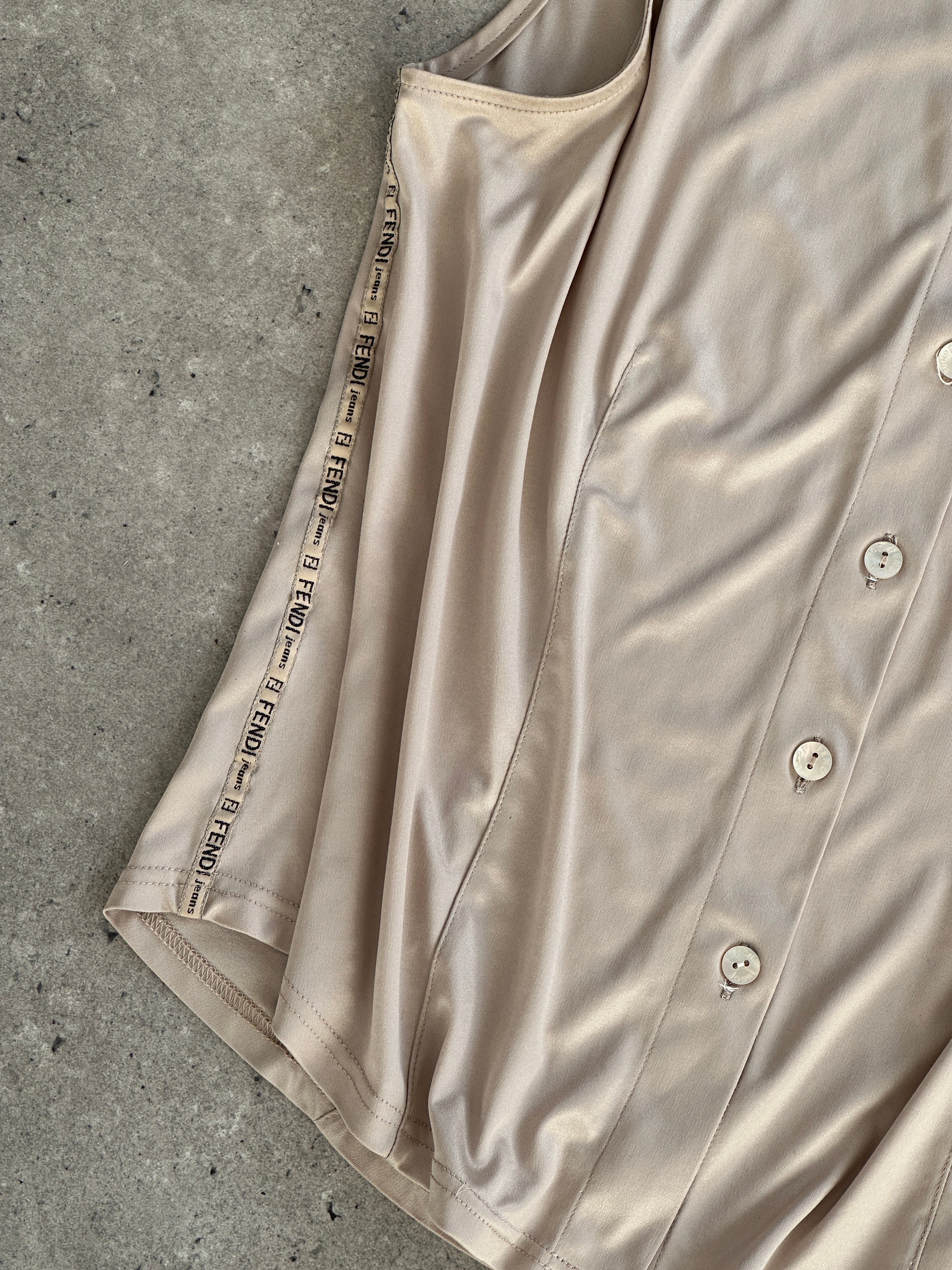 Fendi sleeveless satin logo shirt in size M/L, featuring a smooth fabric and distinctive Fendi branding on the front.