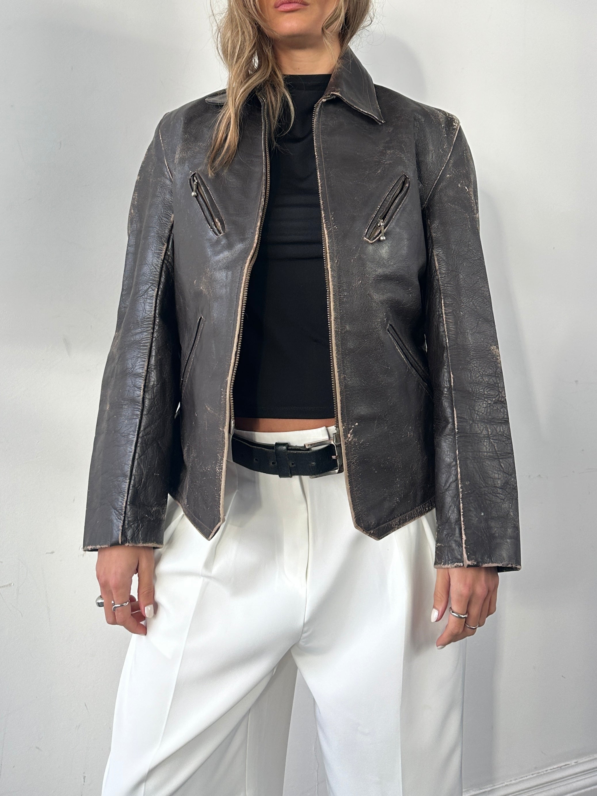 Vintage distressed structured leather jacket in black, featuring classic design and metal hardware, size small/medium.