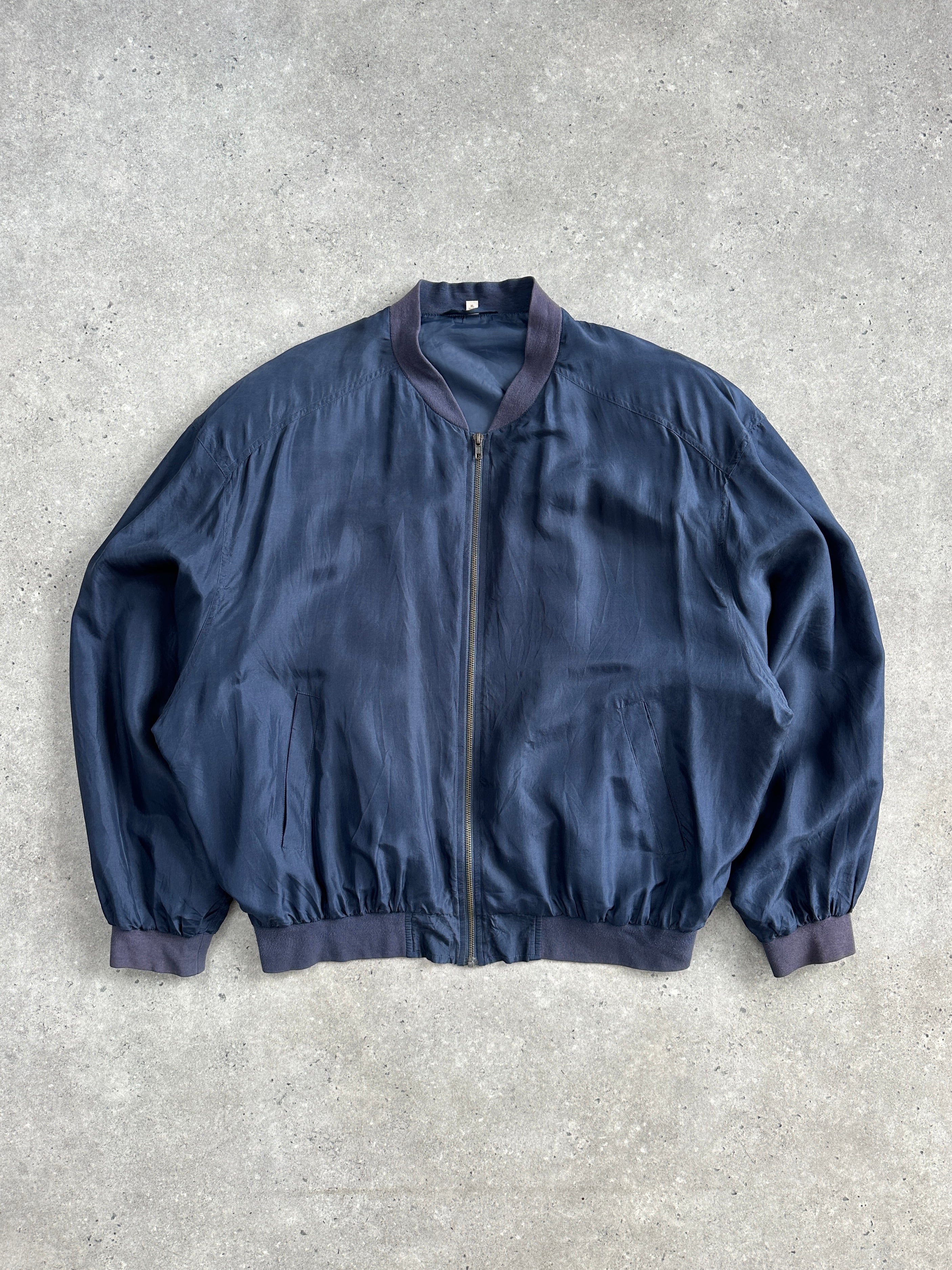Vintage 1980s pure silk bomber jacket in XL/XXL, classic style with a smooth silk finish and retro design details.