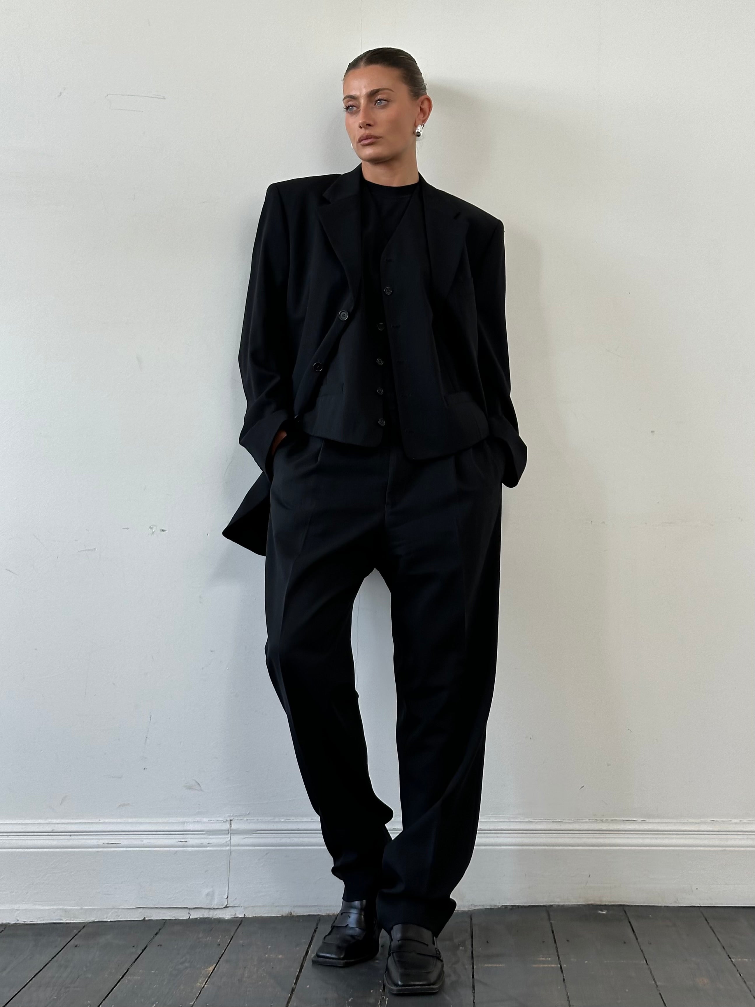 Yves Saint Laurent Pour Homme wool three-piece suit, tailored fit, in size 40L/W32, displayed on a mannequin.