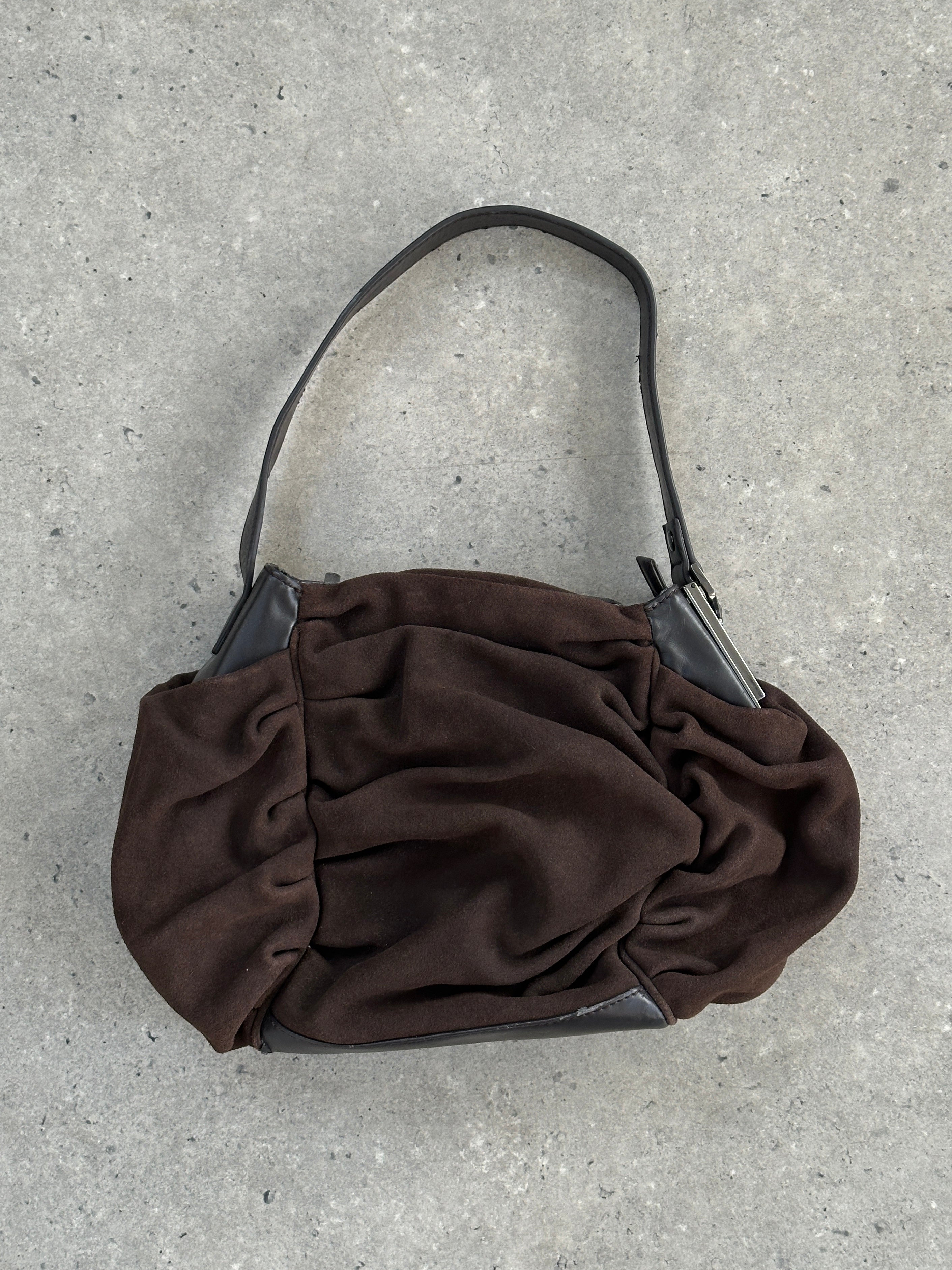 Armani Jeans suede ruched shoulder bag with elegant design and shoulder strap, showcasing soft textured material.