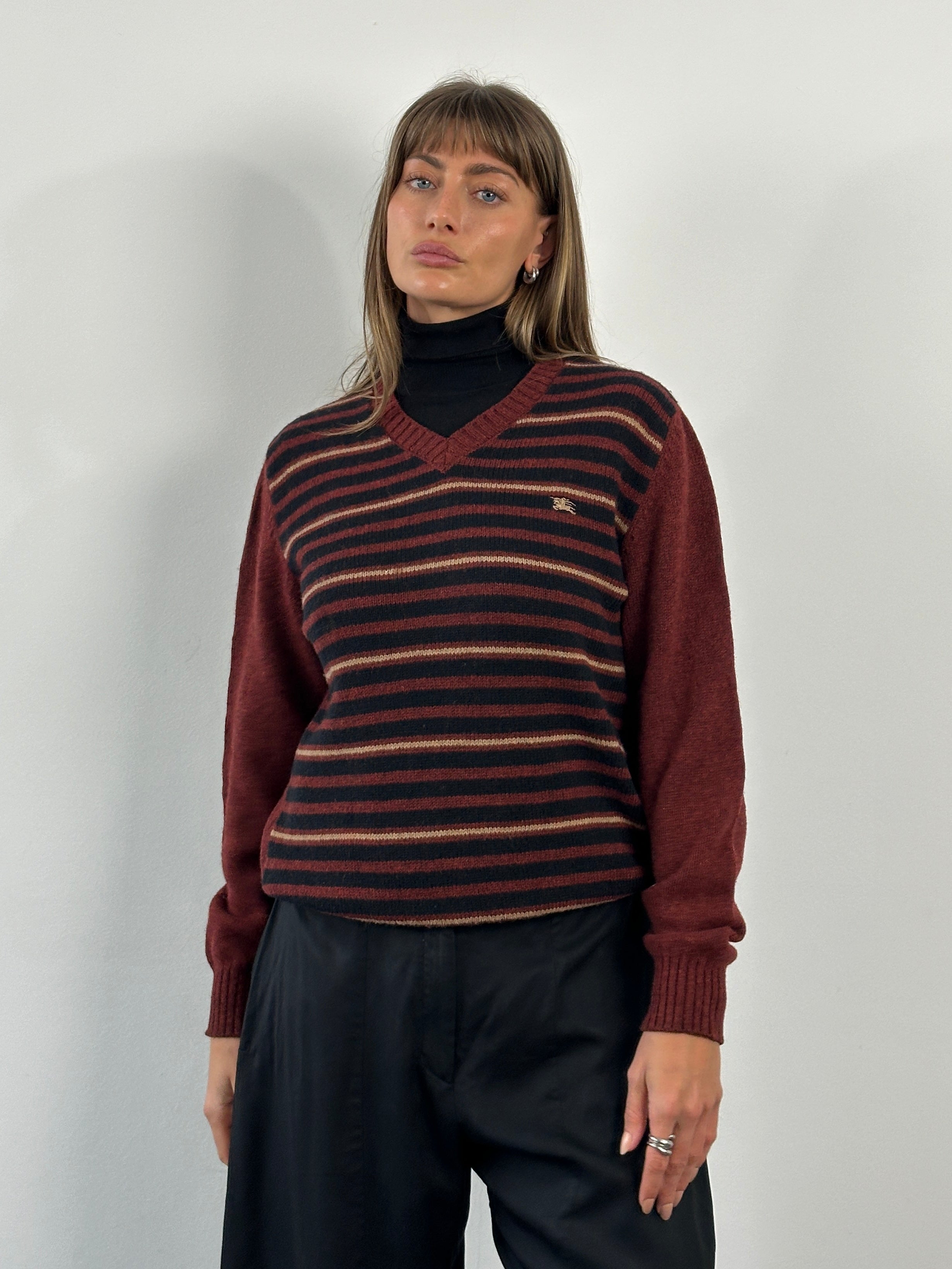Burberry London 2000s lambswool V-neck striped jumper in navy and beige, size M/L, featuring classic design and soft knit fabric.