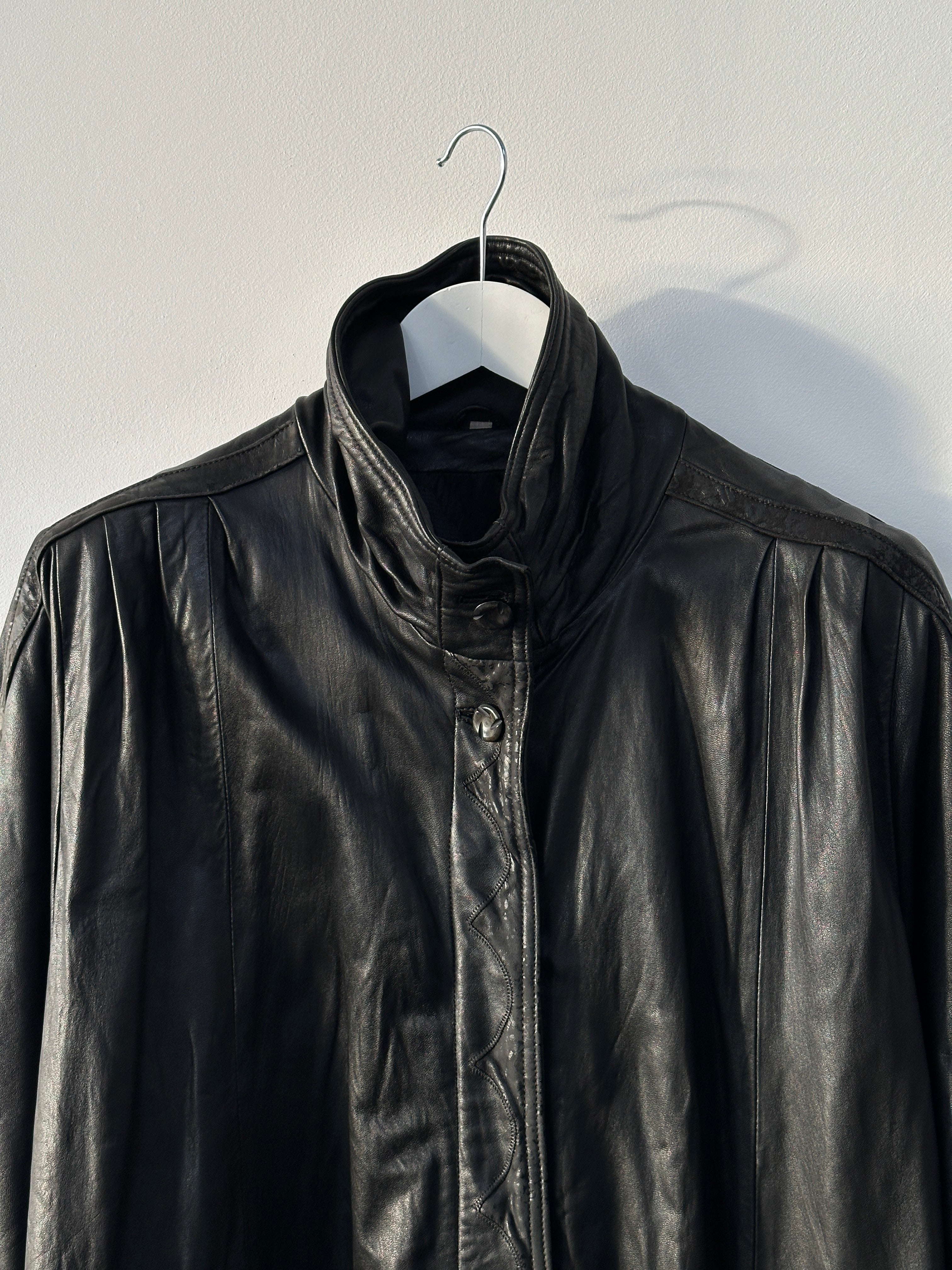 Vintage high neck leather trench coat in XL size, featuring classic design with a high collar and sleek leather finish.
