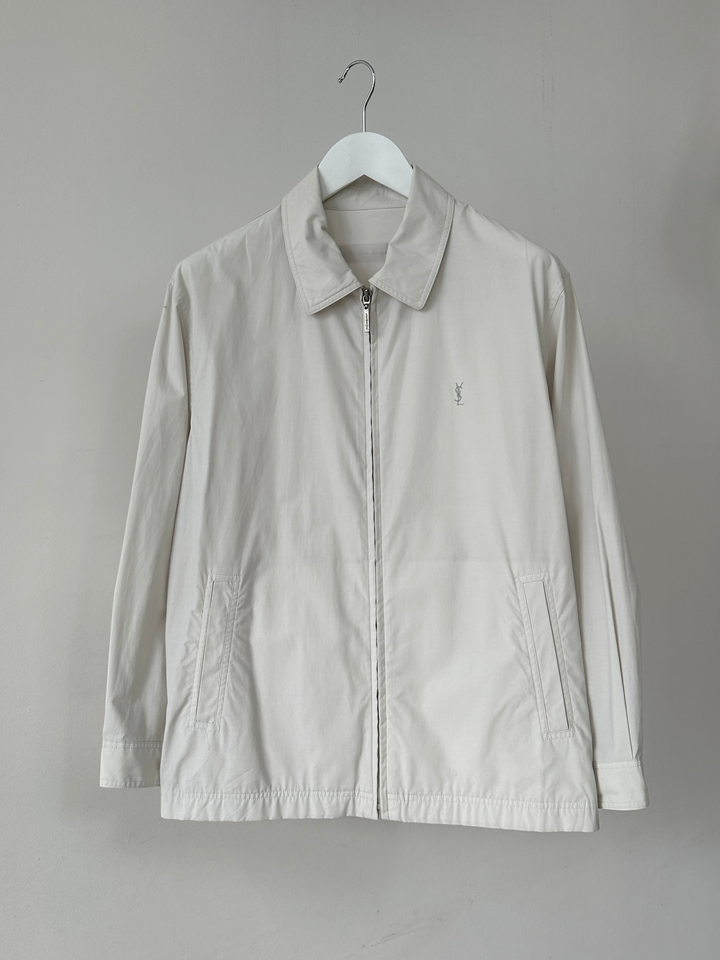 Yves Saint Laurent logo bomber jacket in black with ribbed cuffs and collar, displayed on a hanger.