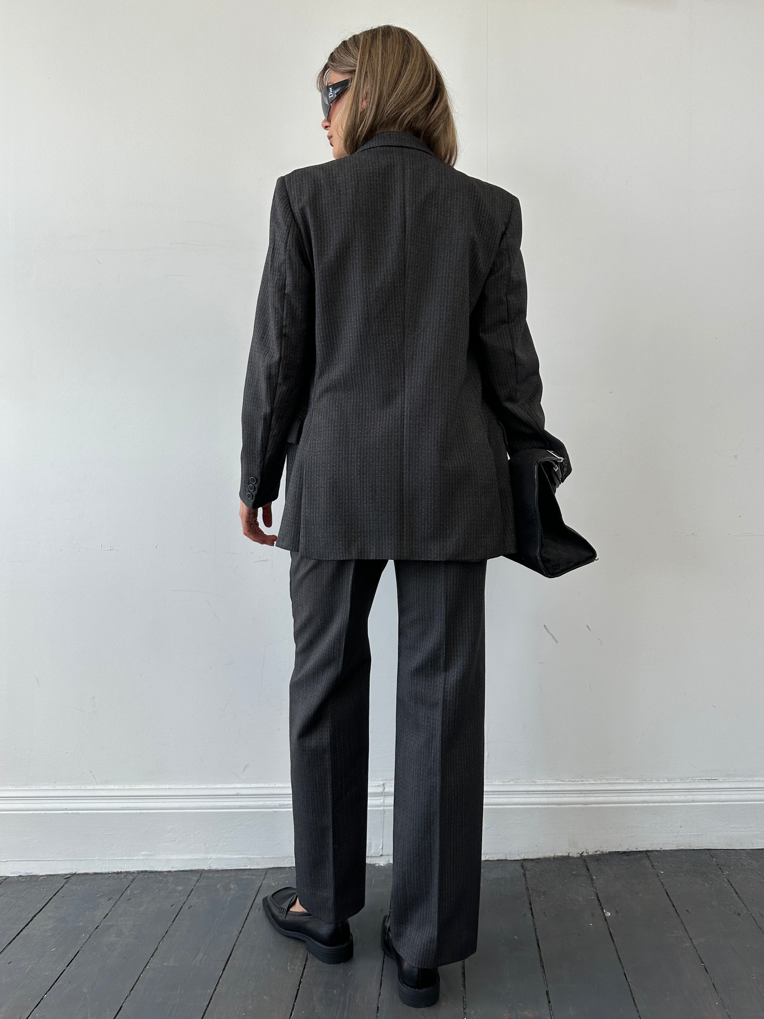Christian Dior pinstripe single-breasted pure wool suit jumpsuit in size 40R/W32, tailored fit with classic lapel design.
